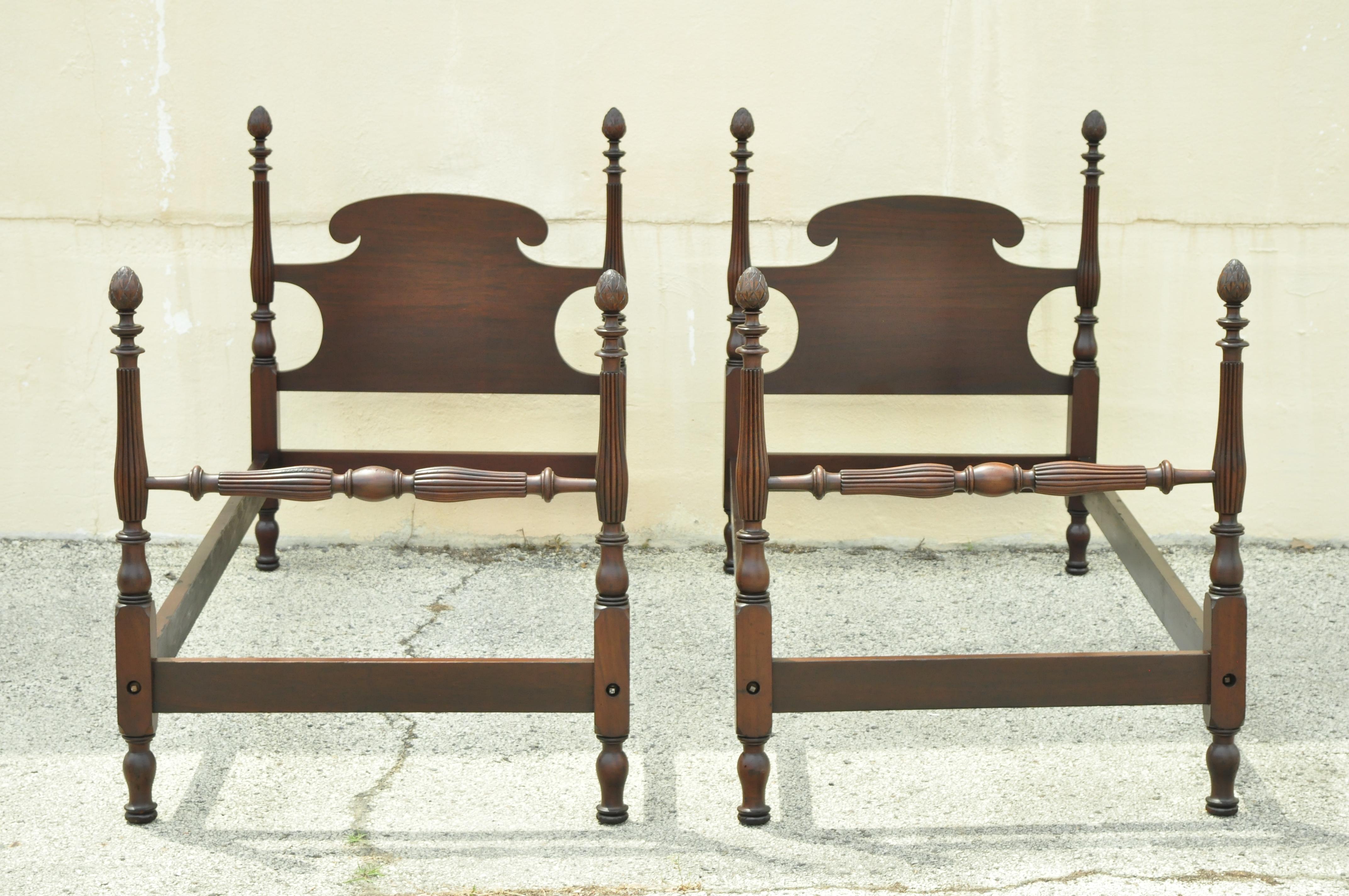 Pair of antique 4 poster mahogany twin single acorn pineapple finial bed frames. Item features bolted rails, tall carved acorn/pineapple finials, twin size frames, solid wood frame, beautiful wood grain, nicely carved details, very nice antique