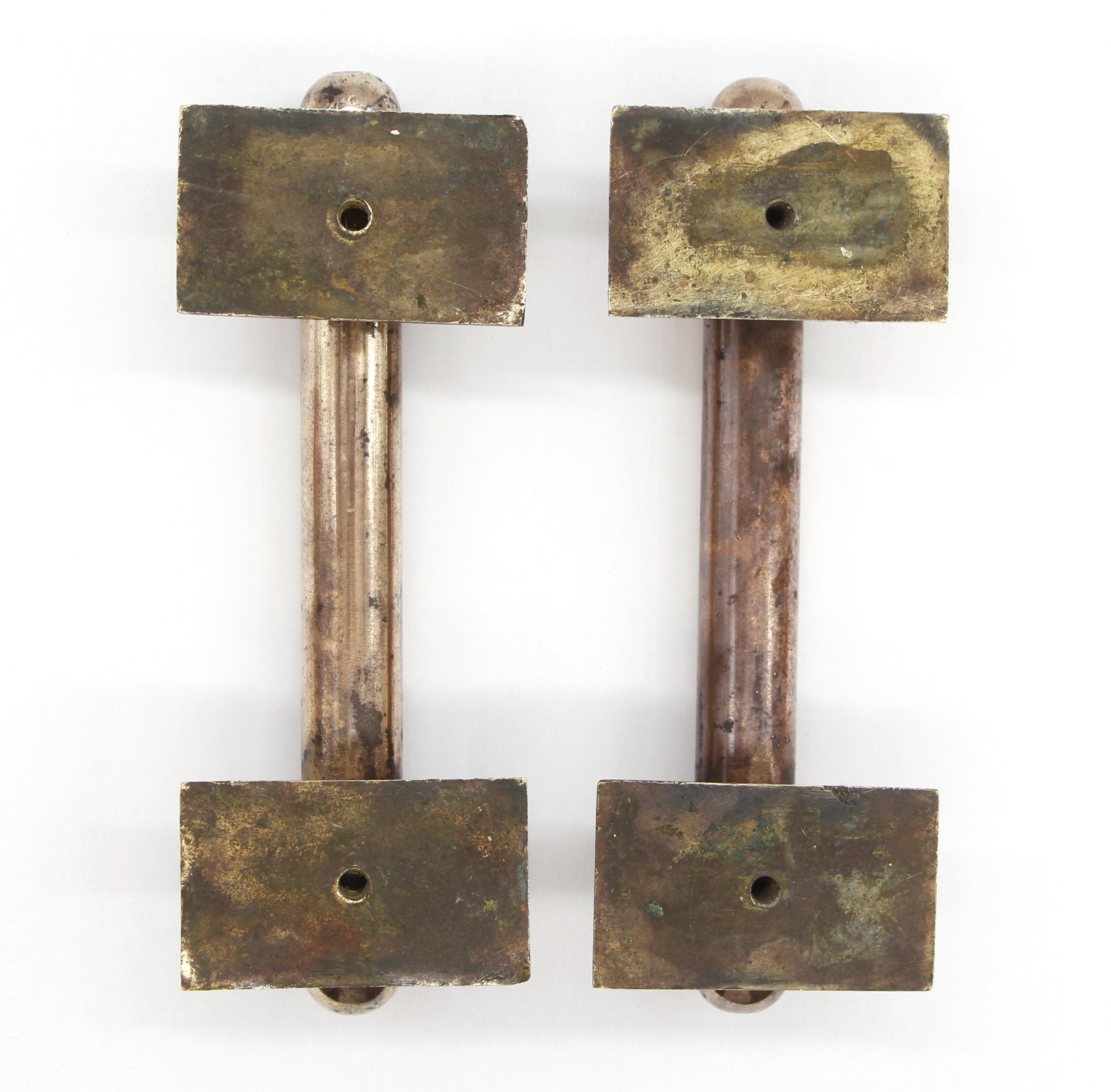 Pair of solid bronze handles or door pulls that have been cleaned and polished to a bright and shiny patina. Good condition with appropriate wear from age. Priced as a pair. Please note, this item is located in our Scranton, PA location.