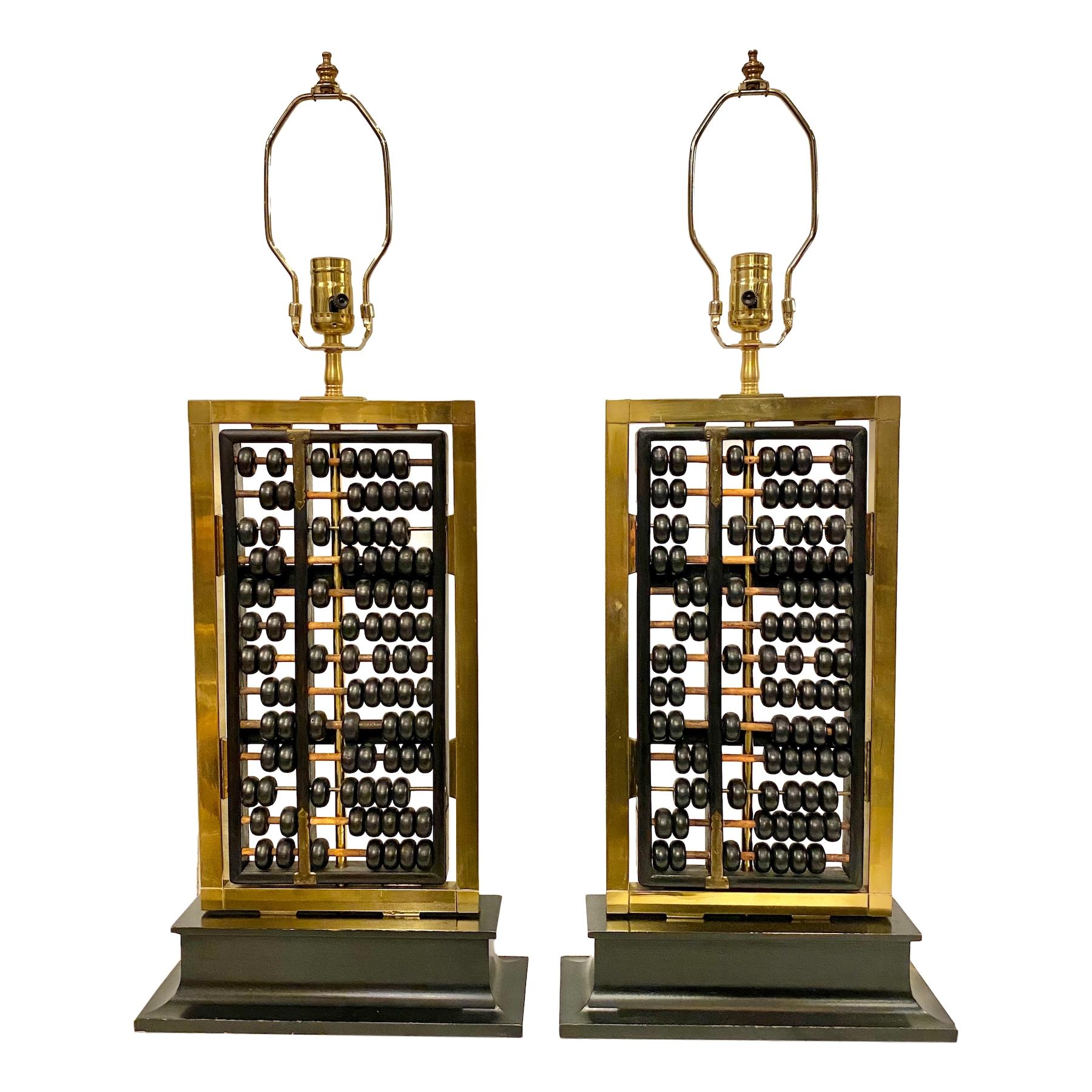 Pair of 1940s Chinese abacus mounted as lamps with bronze details.

Measures: Height of body 20