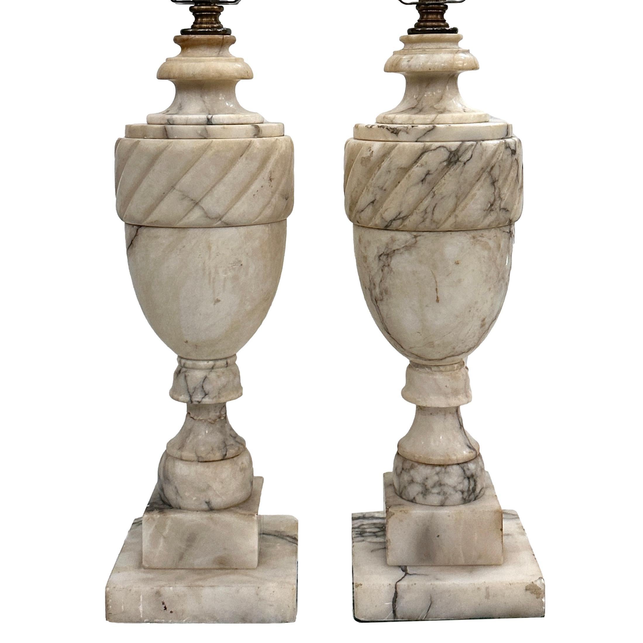 Pair of circa 1920's Italian carved alabaster table lamps with pedestal base.

Measurements:
Height of body: 15