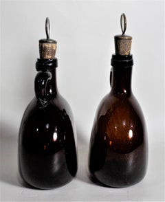 Pair of Antique Amber Glass Liquor Decanters with Mother of Pearl Stoppers