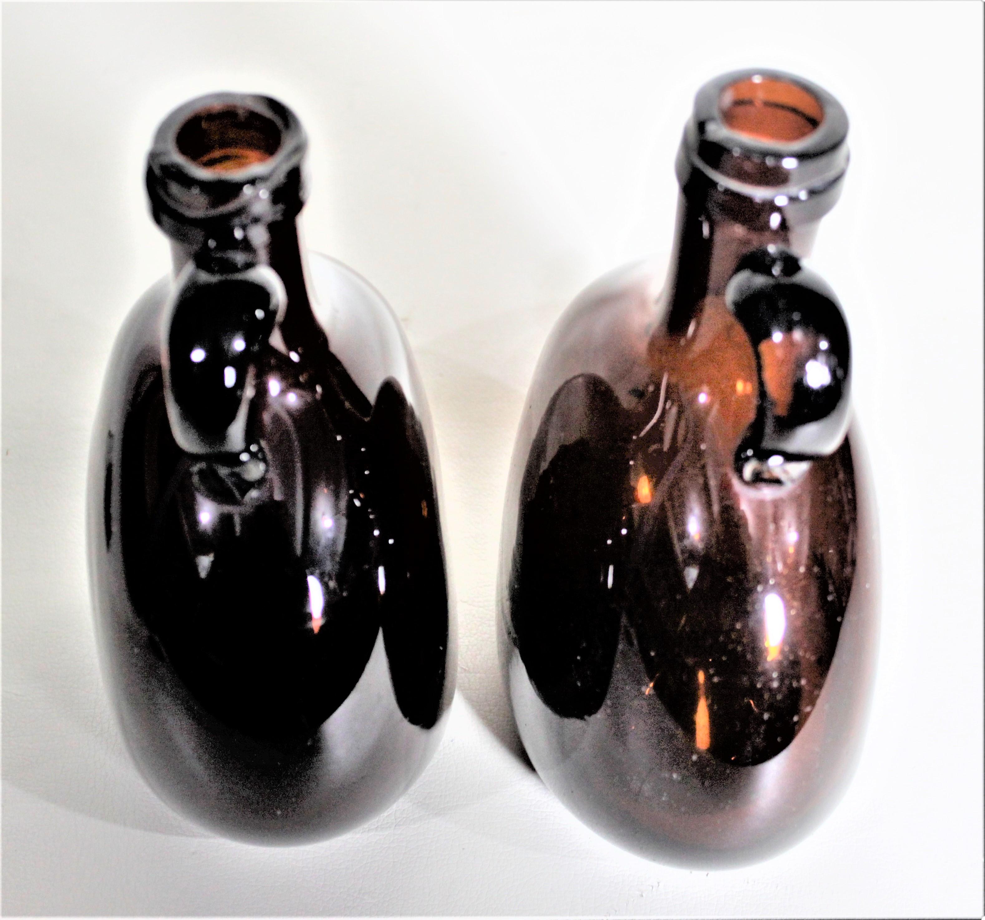 Late Victorian Pair of Antique Amber Glass Liquor Decanters with Mother of Pearl Stoppers For Sale