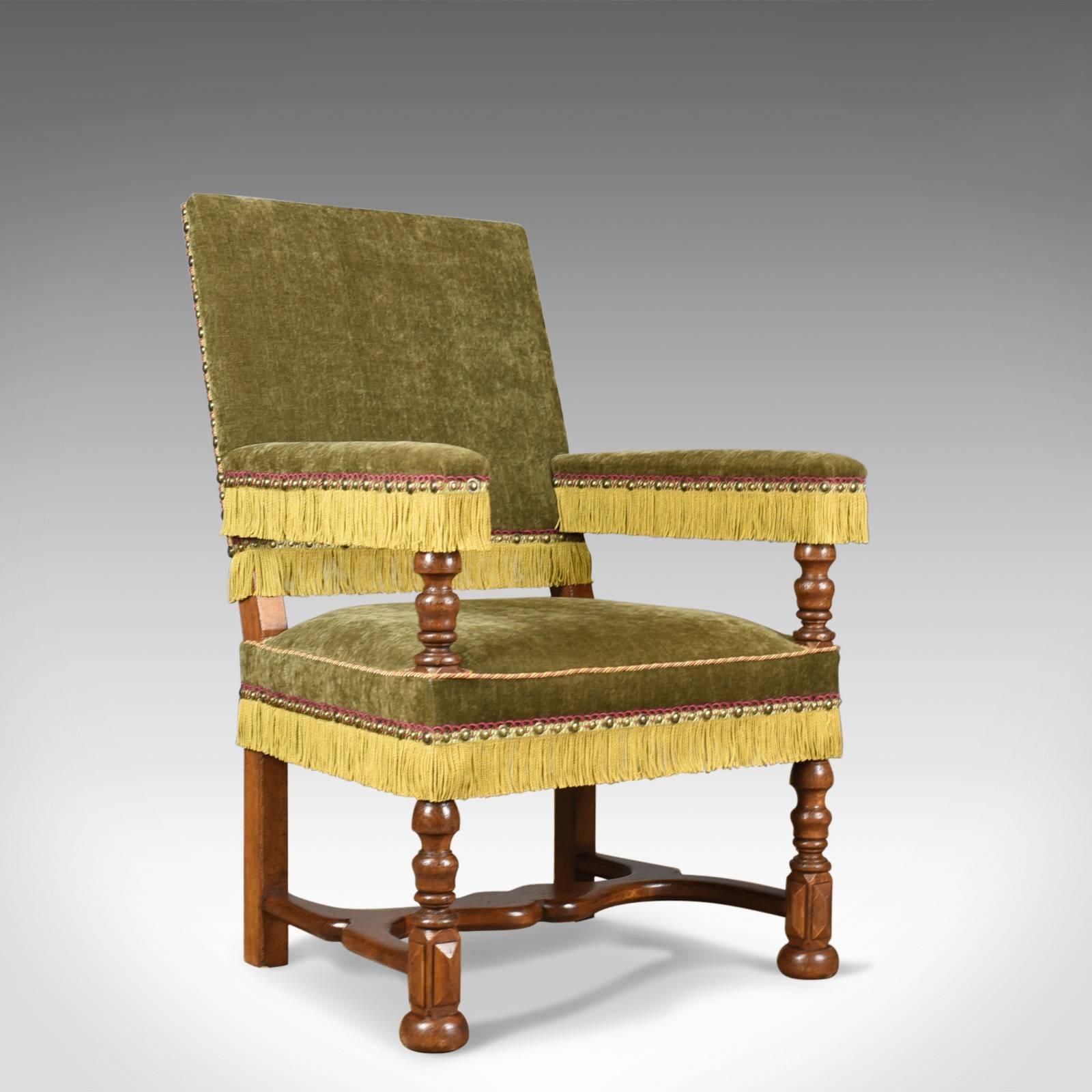 This is a pair of antique armchairs of larger proportions, English, oak framed, Edwardian in the Jacobean taste dating to circa 1910.

Beautifully crafted and finished to a high standard
Oak framed with turned front legs and arm rest