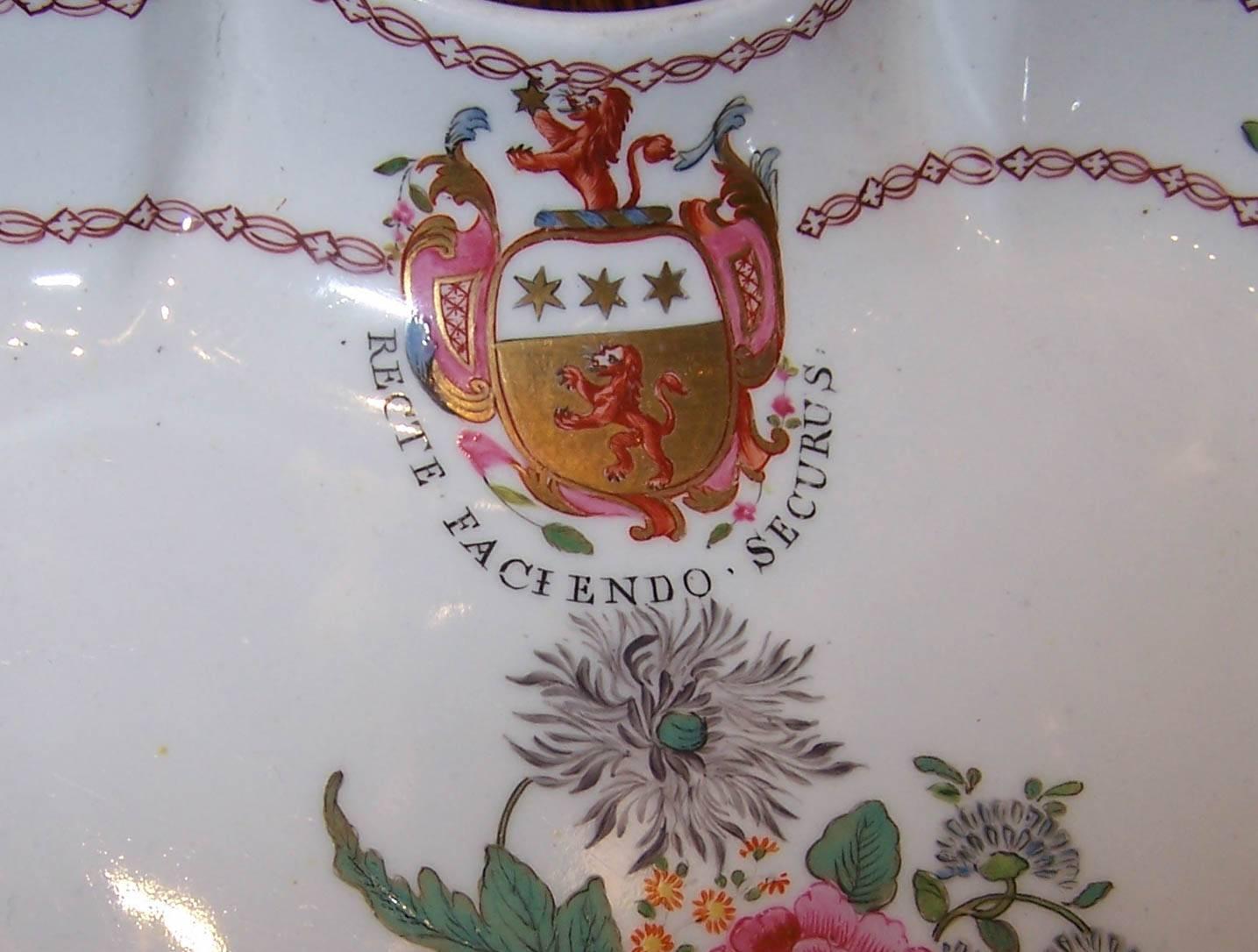 This pair of antique English armorial porcelain dishes display the crest & motto 