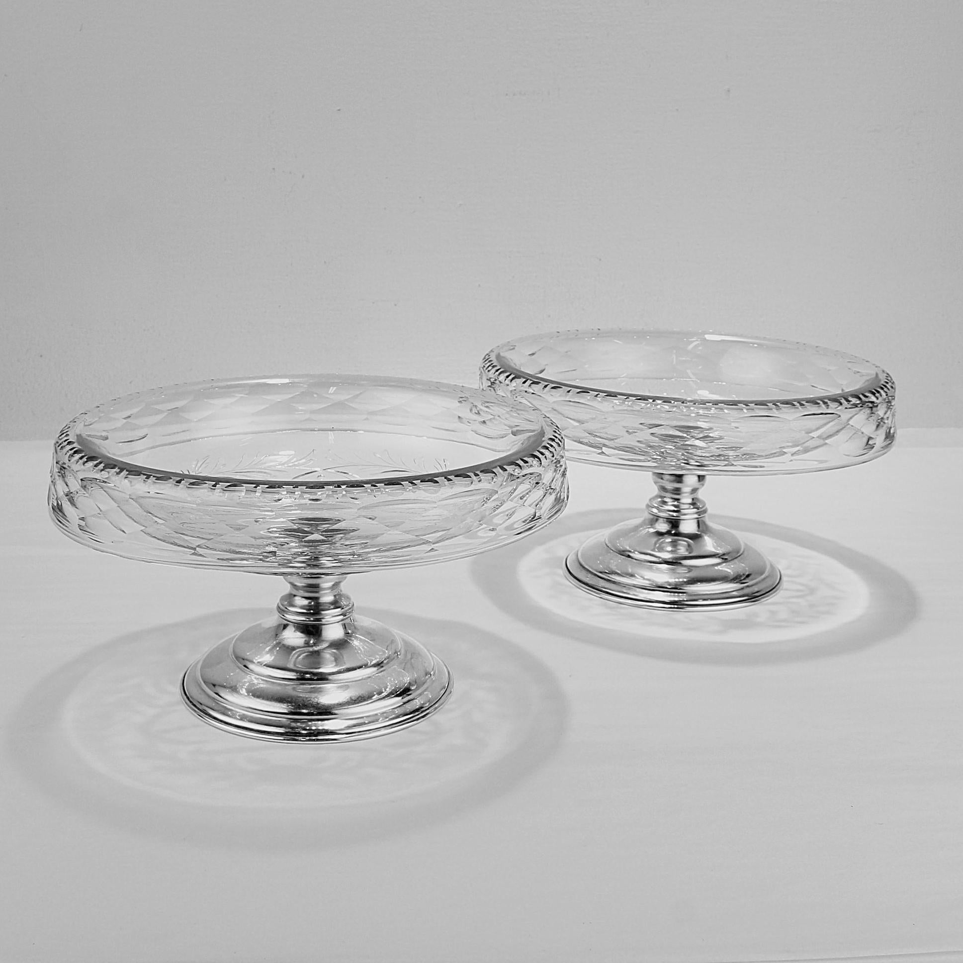 A fine pair of Hawkes footed bowls or compotes.

Model no. S411

With cut glass tops and sterling silver bases. 

Engraved with geometric and floral decoration throughout.
 
Simply wonderful footed bowls!

Date:
Early 20th