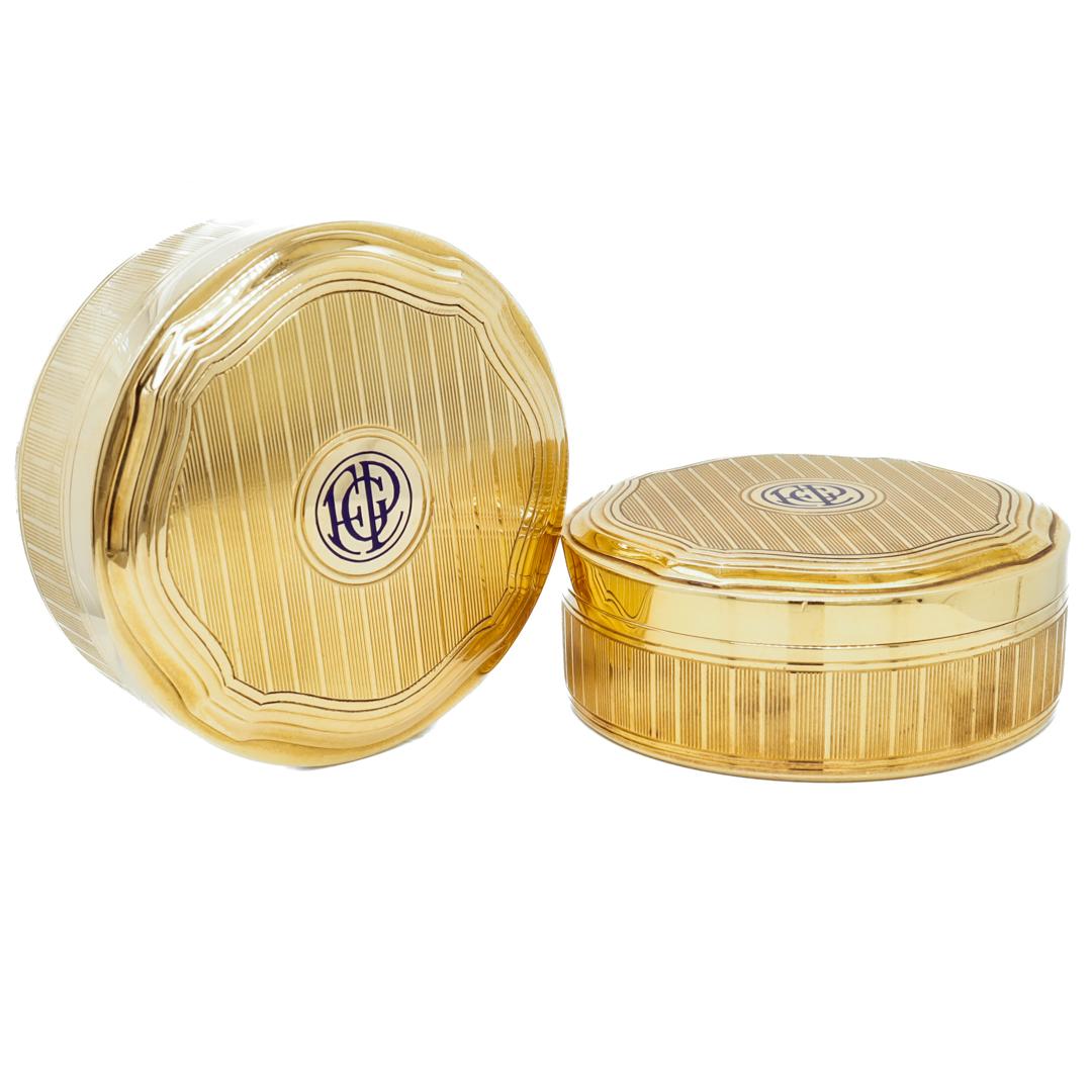 A fine pair of Art Deco pill boxes.

By Tiffany & Co.

In 18k gold with engine-turned decoration, shaped lids, and cobalt blue enamel monograms.

Fully hallmarked to the bases for Tiffany & Co. and with an M for the directorship of John C. Moore II