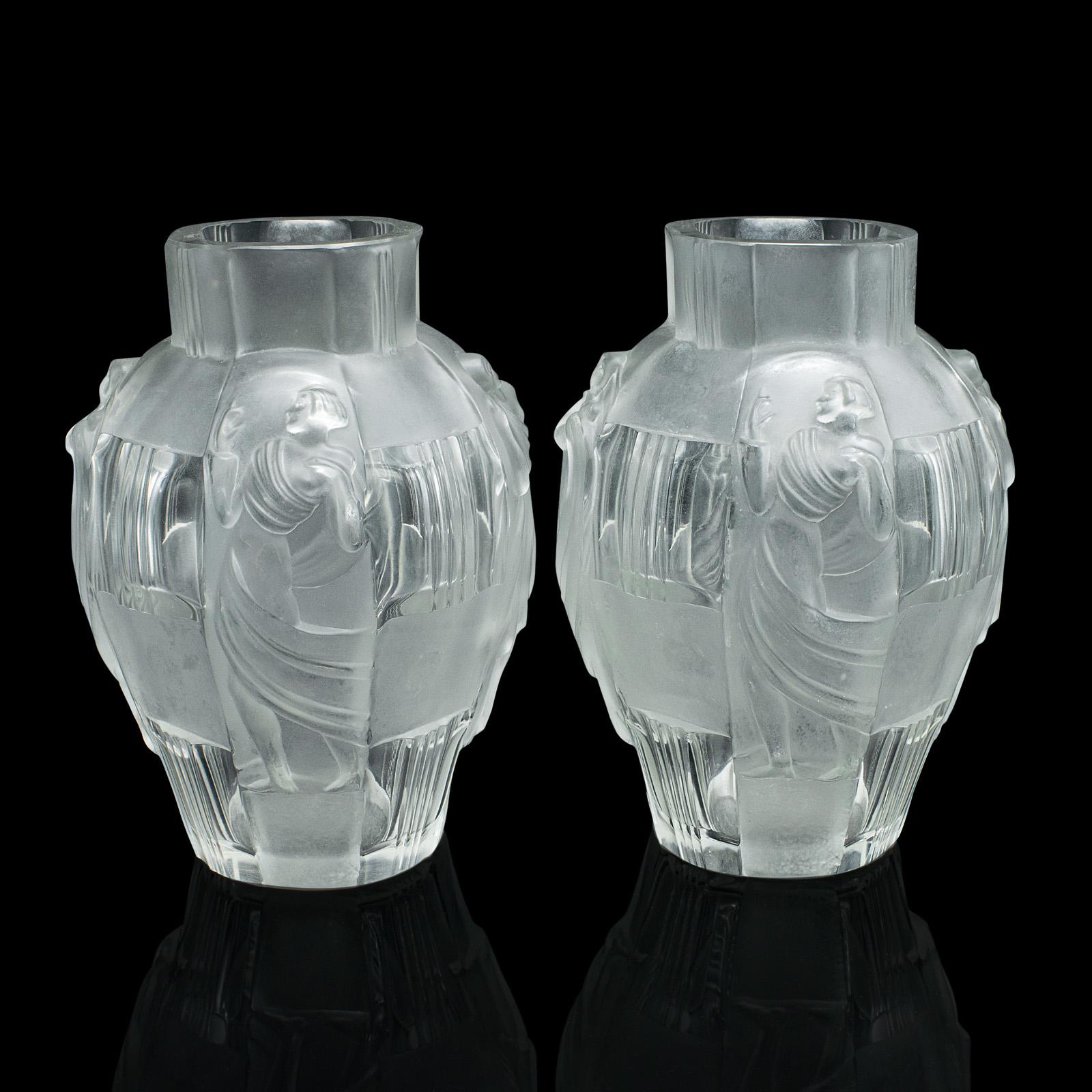 This is a pair of antique Art Nouveau flower vases. A French, frosted glass decorative urn in the manner of Lalique, dating to the early 20th century, circa 1920.

Wonderfully evocative vases with an attractive appearance
Displaying a desirable aged