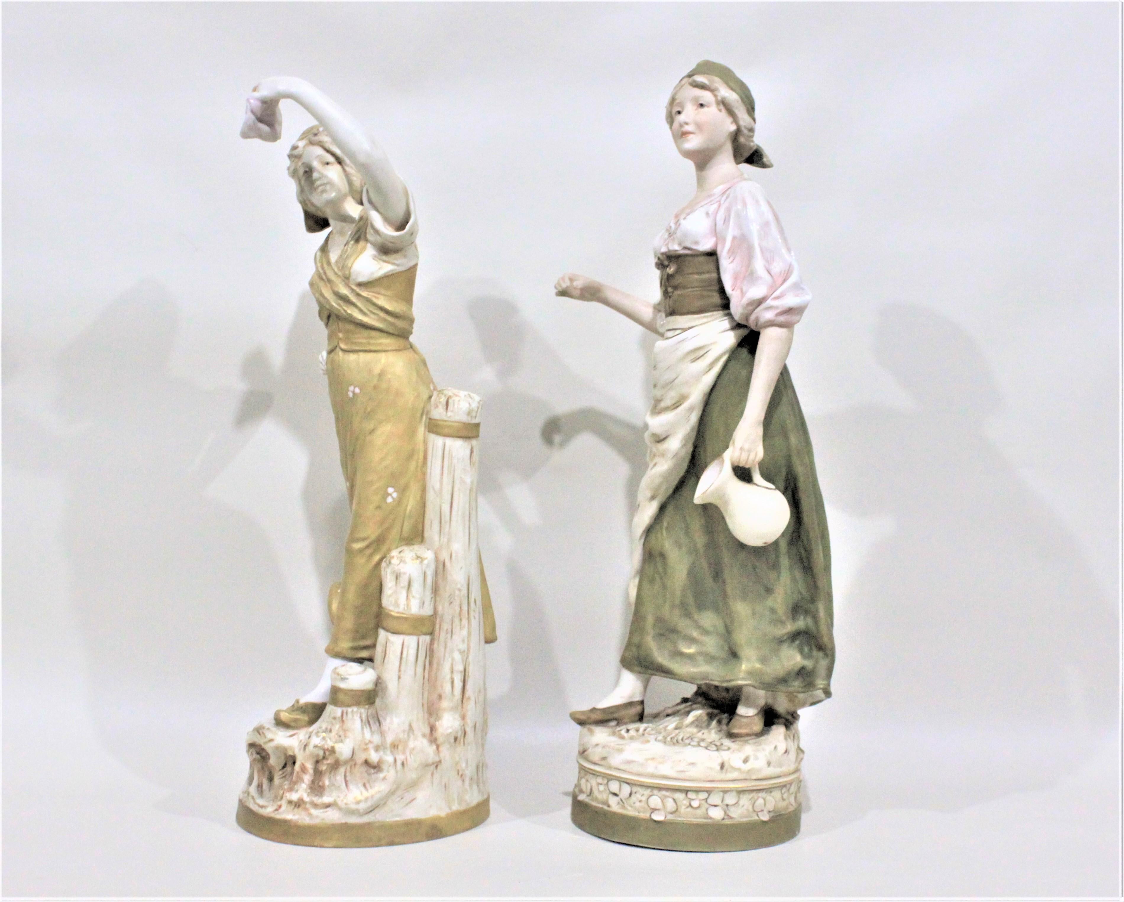 Hand-Crafted Pair of Antique Art Nouveau Royal Dux Porcelain Figurines For Sale