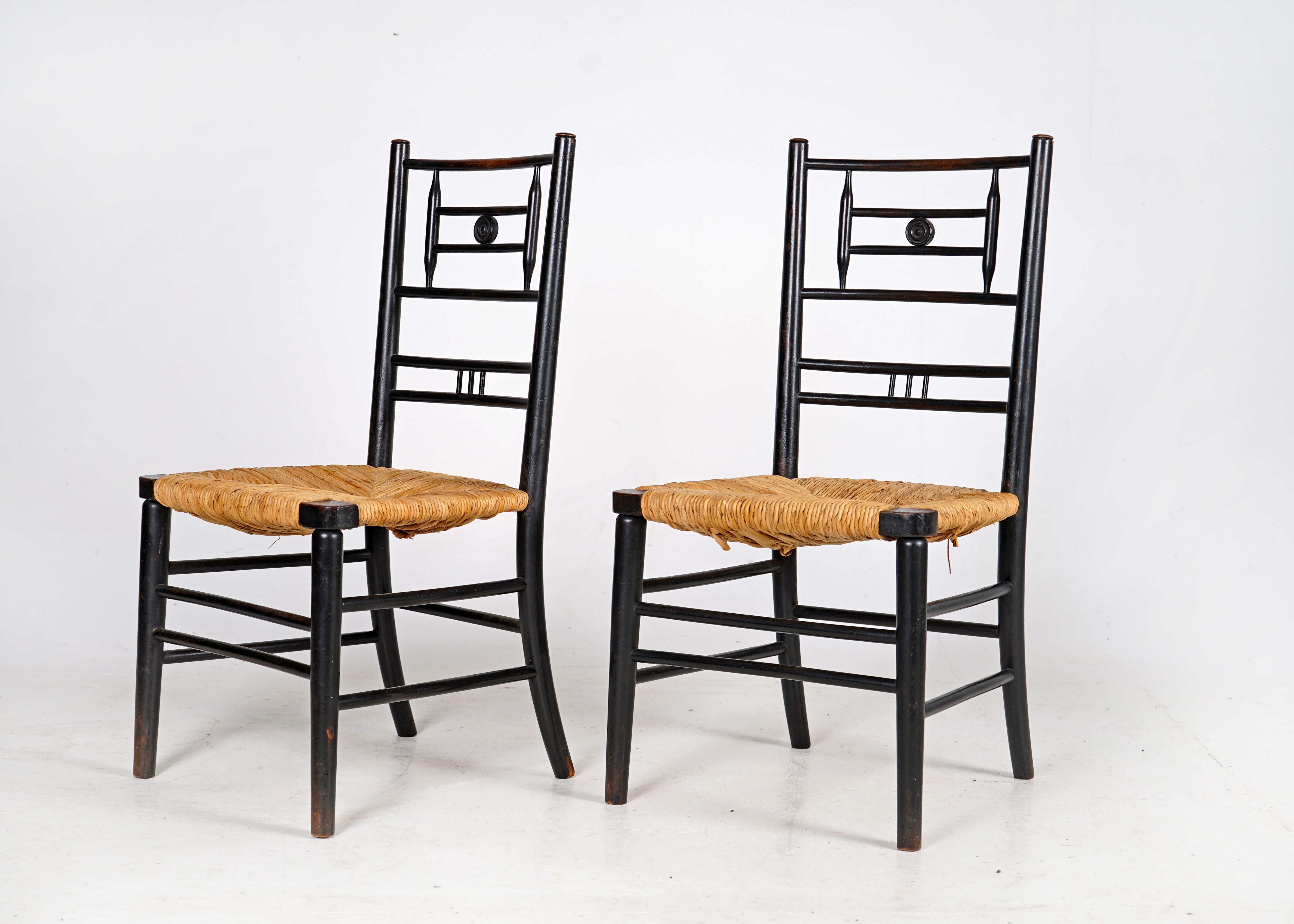 Ebonized Pair of Antique Arts and Crafts Ebonised Rush Seat Chairs