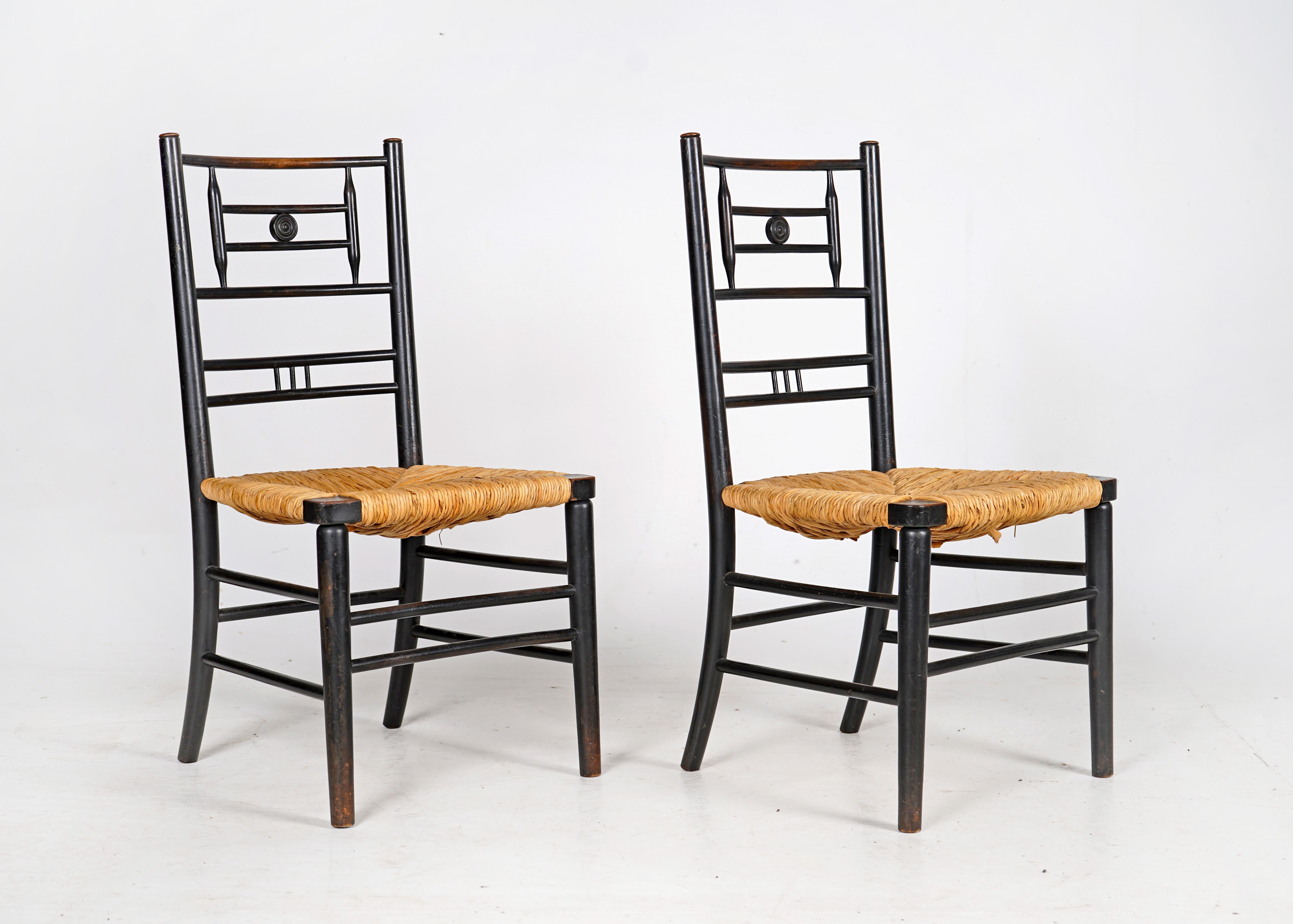 Pair of Antique Arts and Crafts Ebonised Rush Seat Chairs In Good Condition In Dorchester, GB