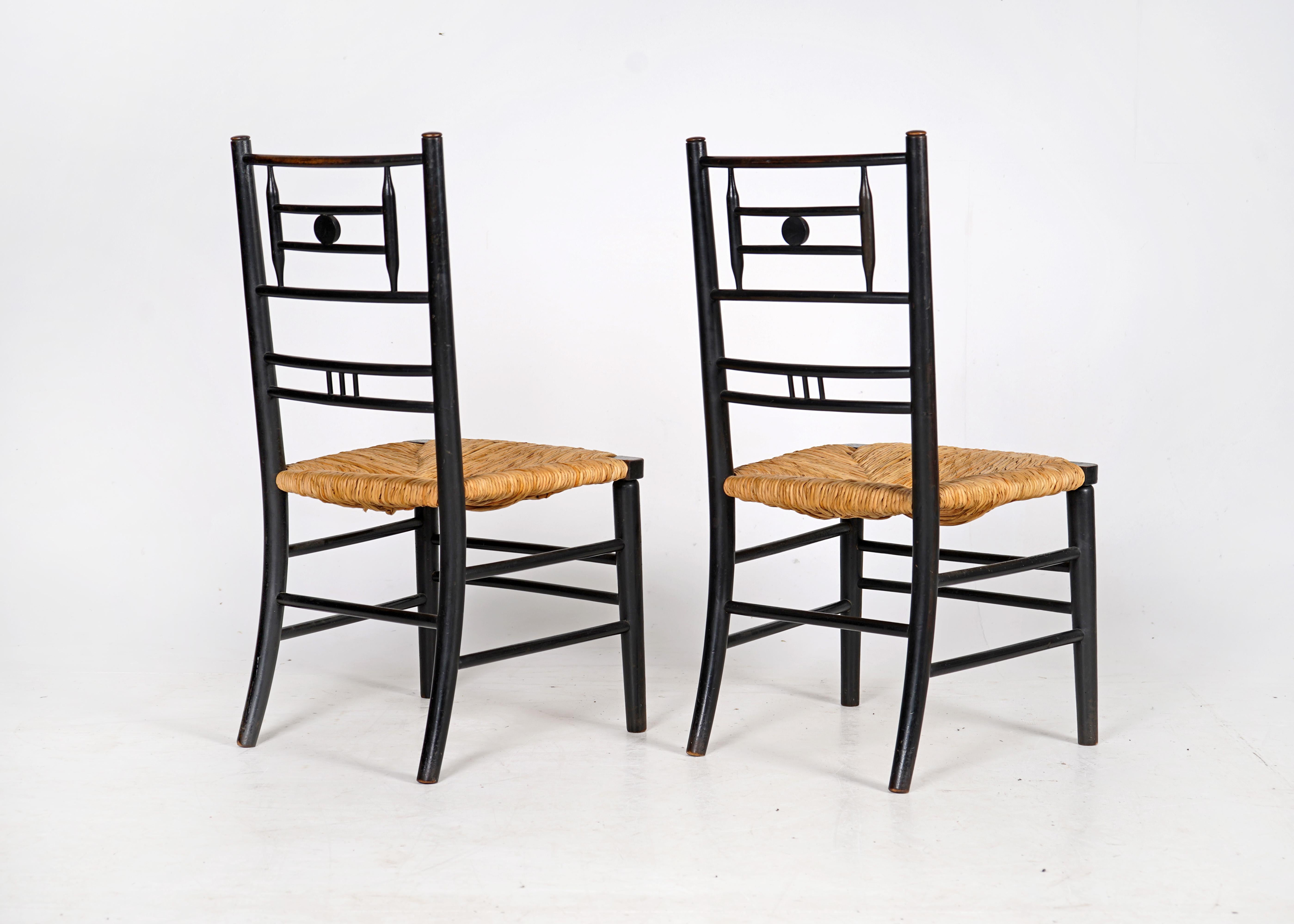 20th Century Pair of Antique Arts and Crafts Ebonised Rush Seat Chairs