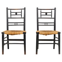 Pair of Antique Arts and Crafts Ebonised Rush Seat Chairs