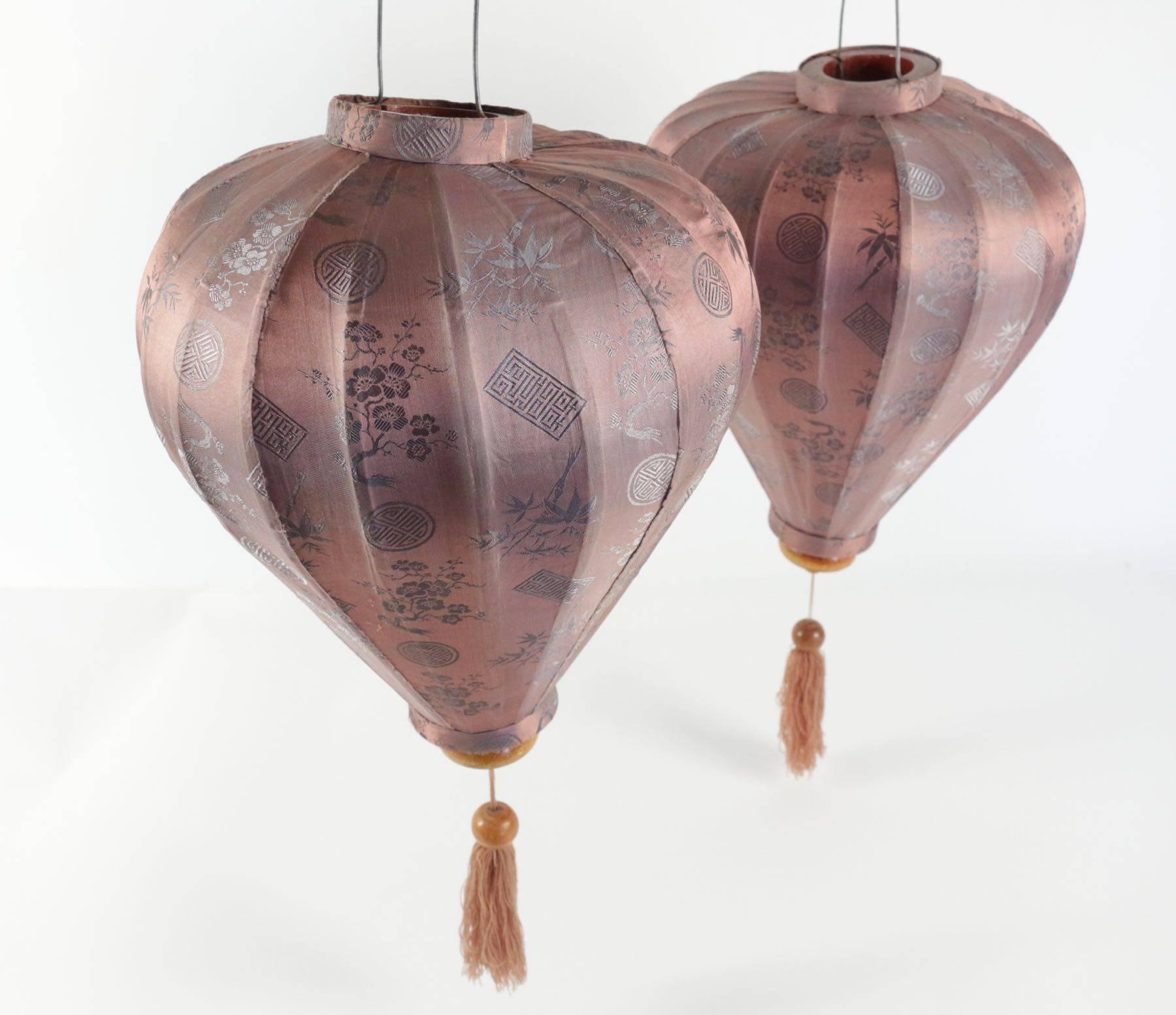 Pair of antique Asian lanterns in silk and wood.