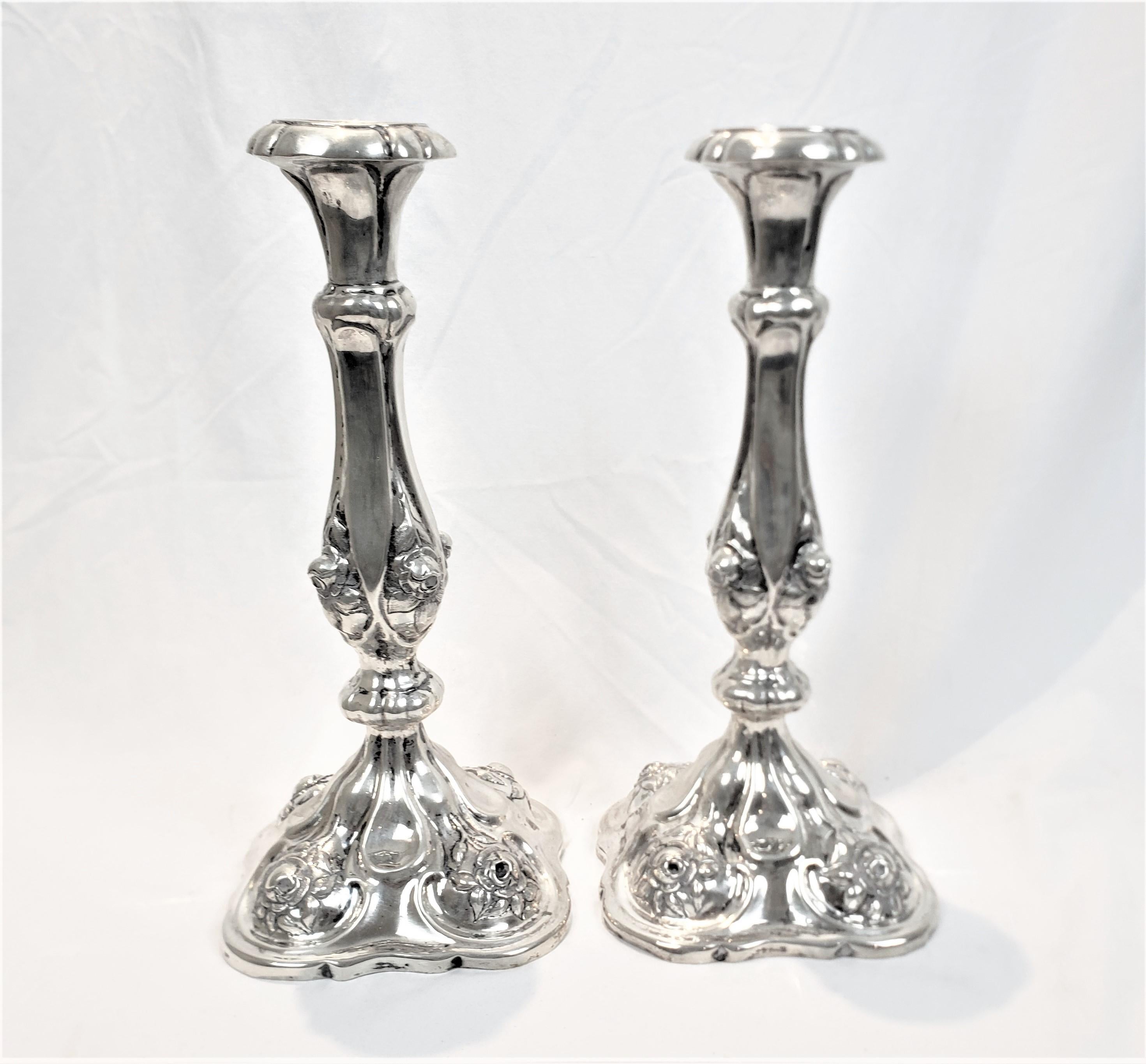 Empire Pair of Antique Austro-Hungarian Silver Candlesticks with Chased Flowers For Sale