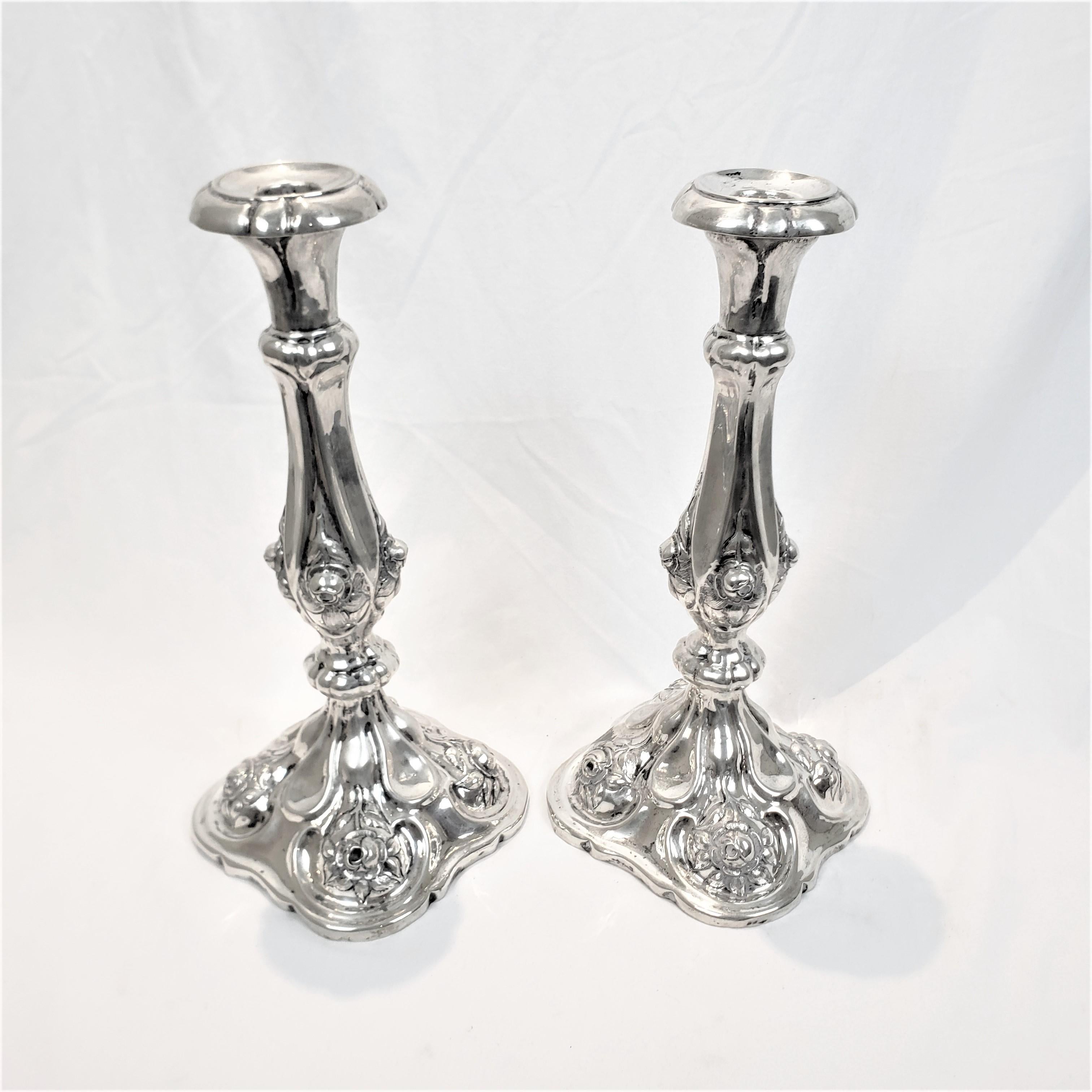 Austrian Pair of Antique Austro-Hungarian Silver Candlesticks with Chased Flowers For Sale