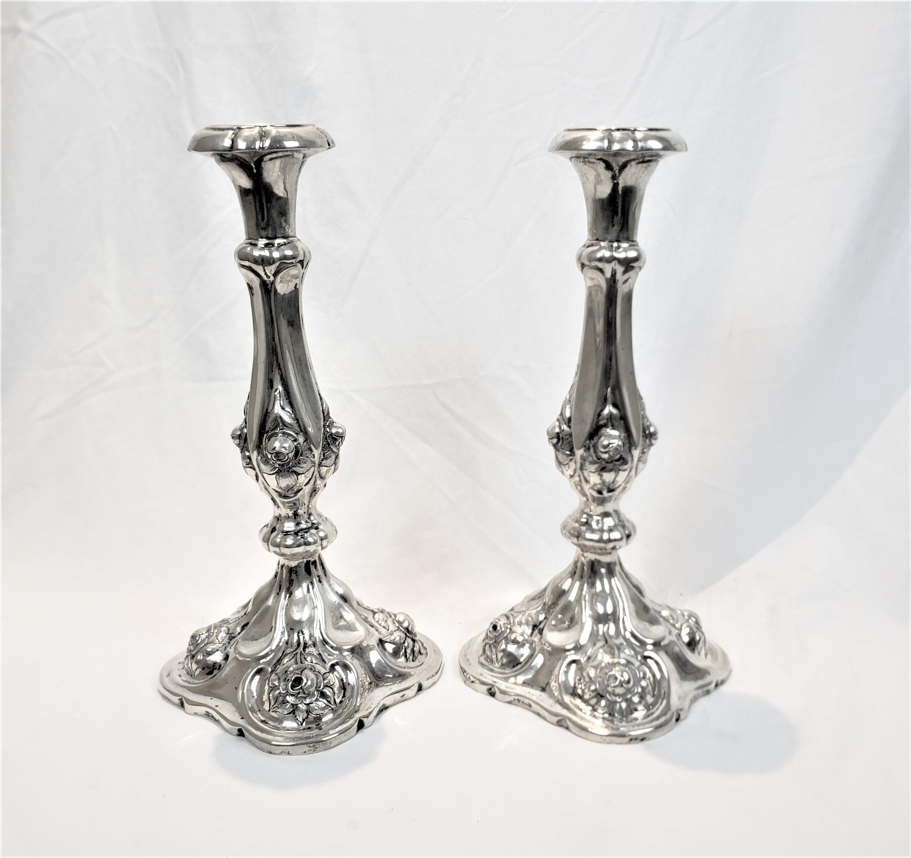 Hand-Crafted Pair of Antique Austro-Hungarian Silver Candlesticks with Chased Flowers For Sale