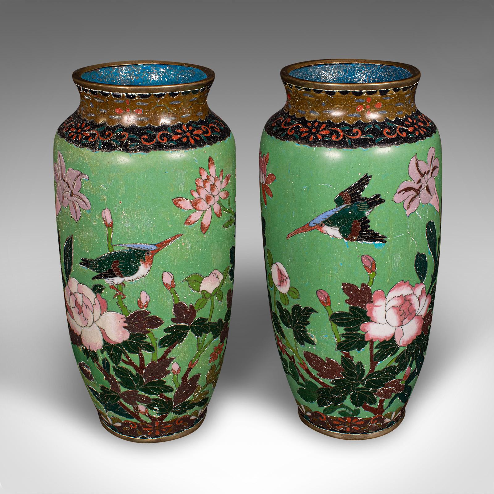 
This is a pair of antique baluster vases. A Japanese, cloisonné flower urn in Meiji taste, dating to the early Victorian period, circa 1850.

Delightfully charming vases with sweet foliate and bird motif
Displaying a desirable aged patina - one