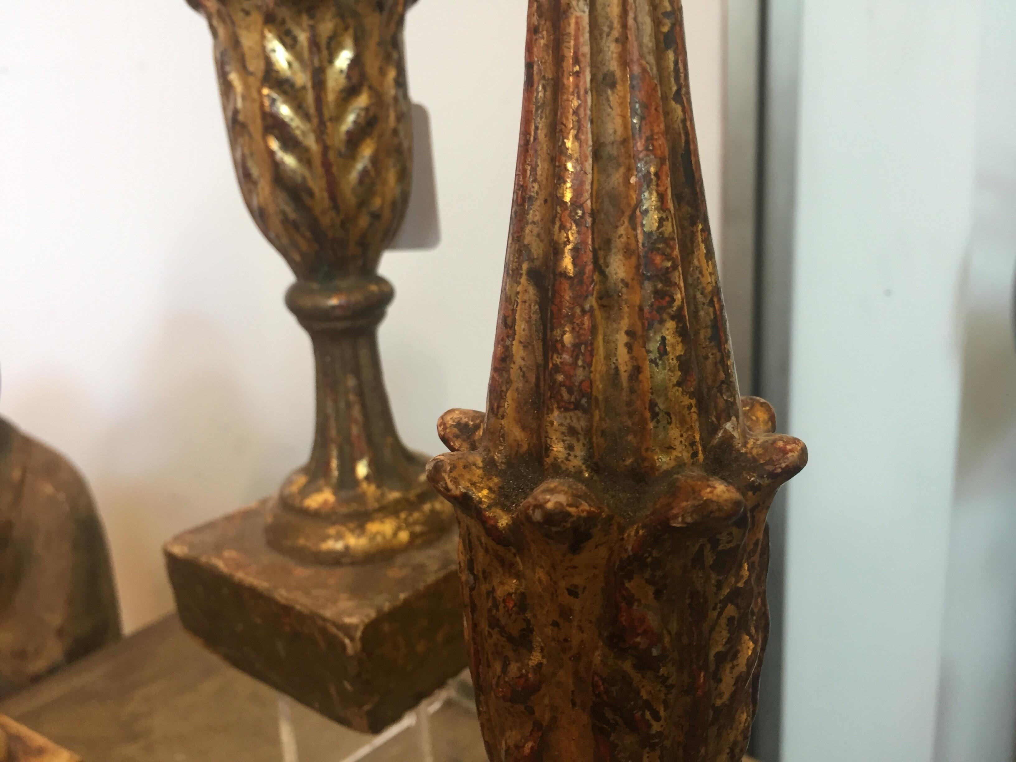 Two hand carved wooden candlesticks made in Sicily in 18th century, in the early 20th century they have been electrified to be used as a lamp.