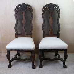 Pair of Antique Baroque Style Dutch Carved Walnut and Bergère Side Chairs.