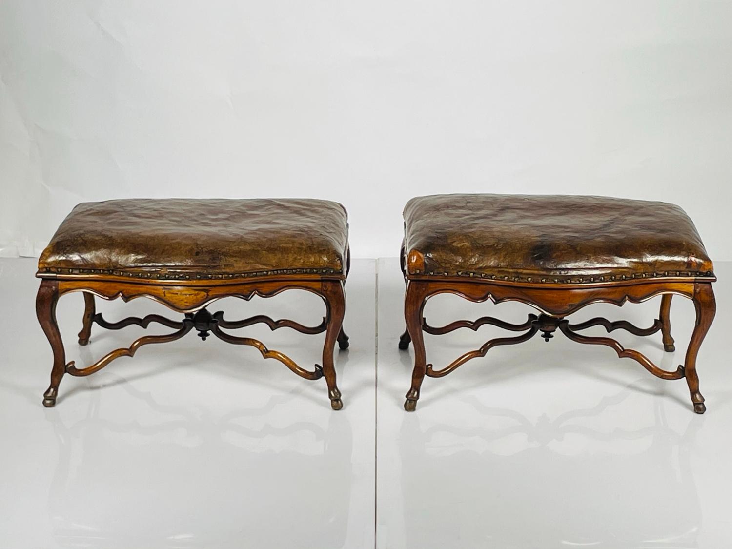 Introducing our exquisite Pair of Antique Benches in Mahogany & Leather, crafted with utmost precision and elegance in the heart of France. This stunning duo showcases the perfect blend of timeless beauty and unmatched craftsmanship, adding a touch