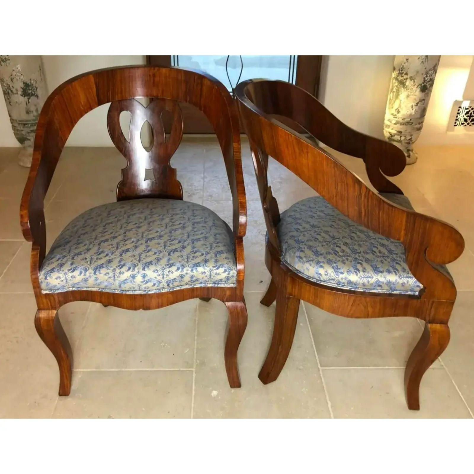 Pair of antique Biedermeier mahogany barrel chairs. Each upholstered in fine blue Fortuny fabric.

Additional information: 
Materials: Cotton, Mahogany
Please note that this item contains materials that are legally subject to a special export