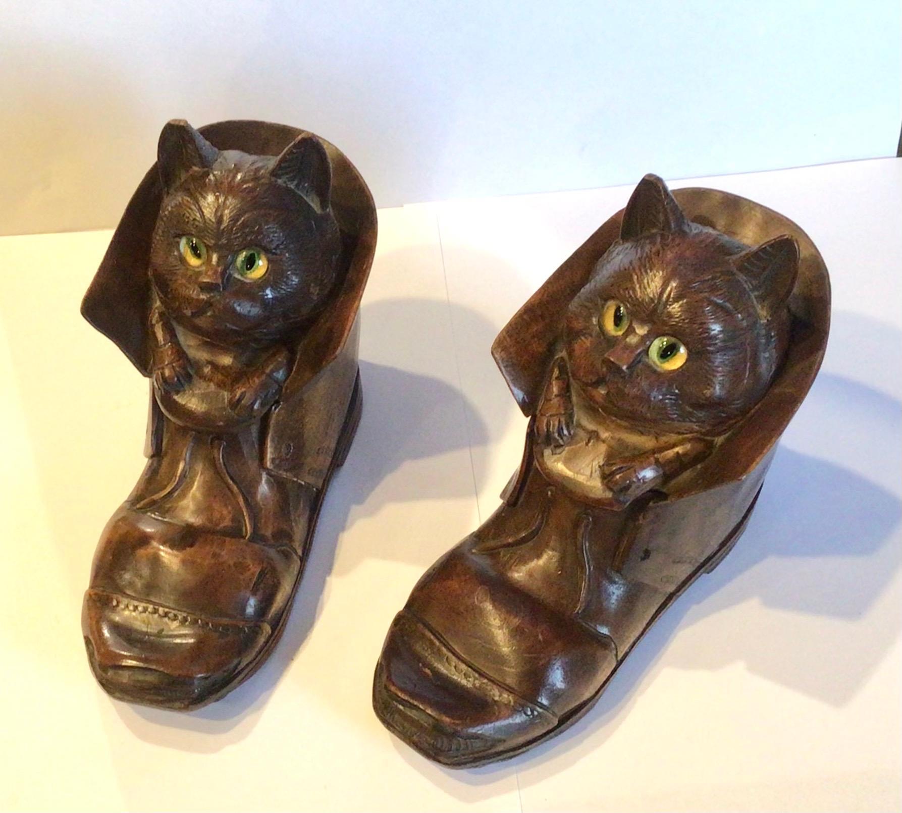 This Pair of whimsically themed and beautifully carved antique linden wood inkwells will charm you with their exquisite style. The expression of the cats that has found a home inside an old boot, is wonderful. Their yellow eyes add to their air of