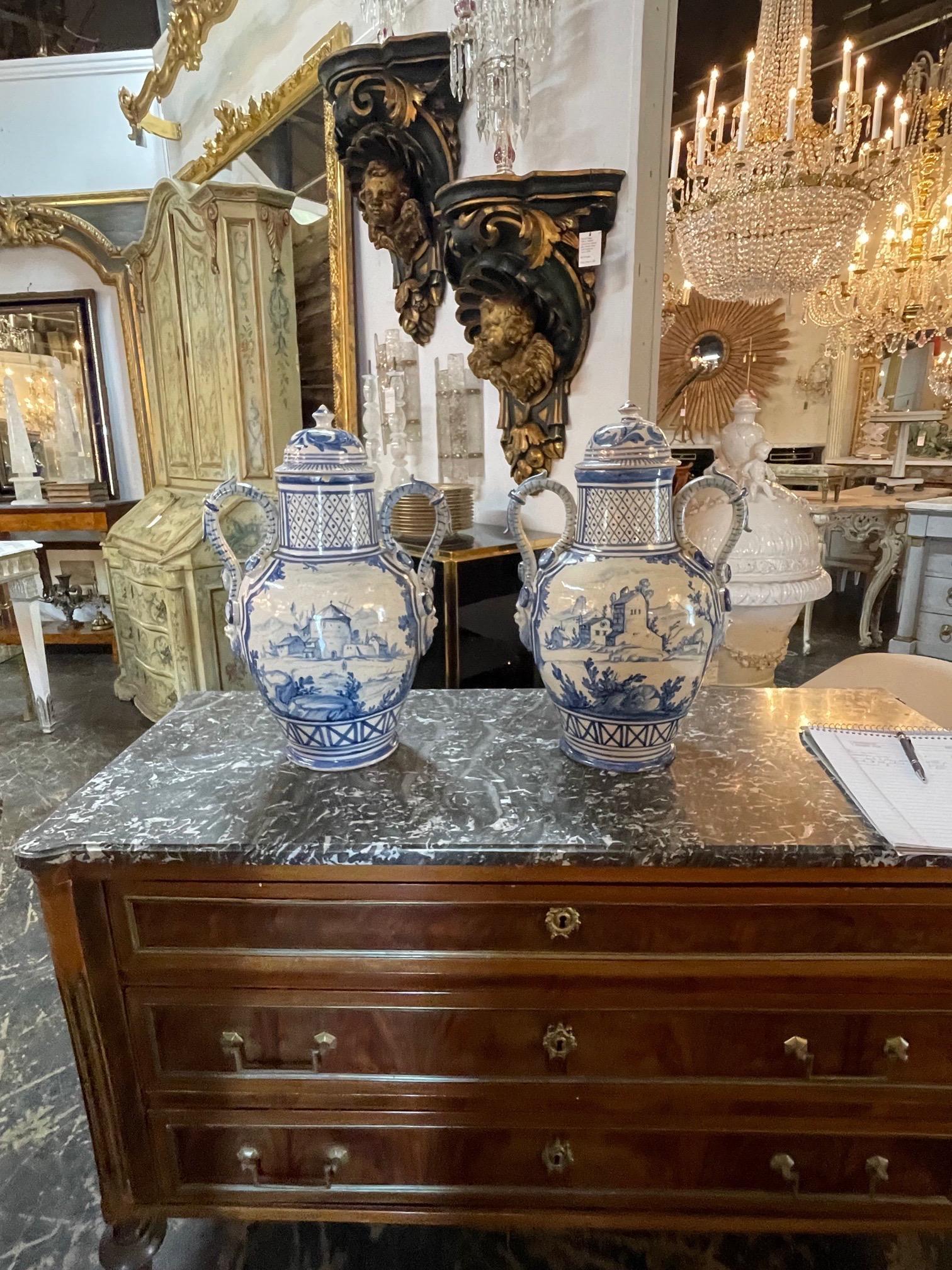 Gorgeous pair of antique blue and white vases. Interesting decorative designs. Makes a fabulous accessory!