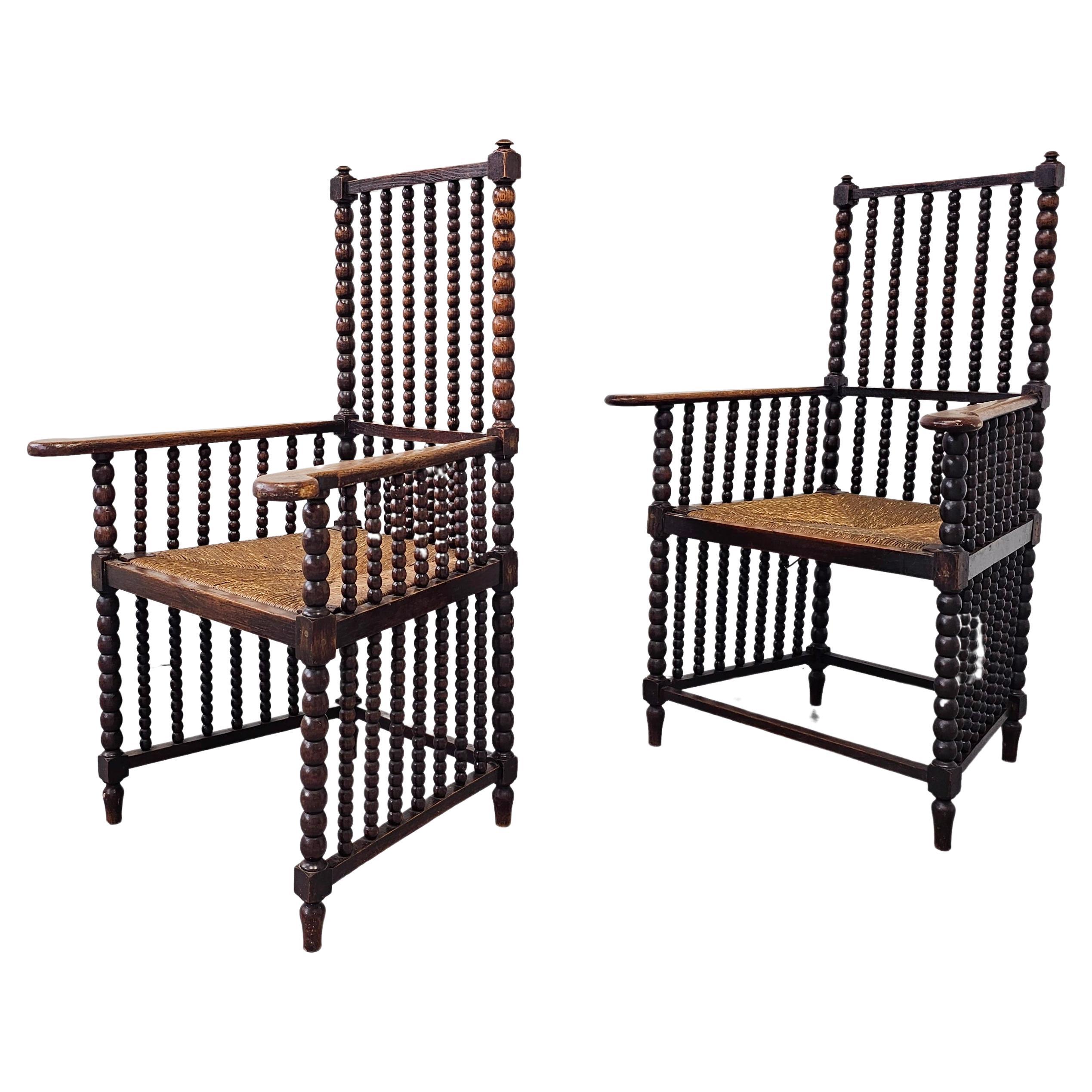 Coppia di antiche poltrone a tombolo in Oak con sedute in giunco, Francia, 1900