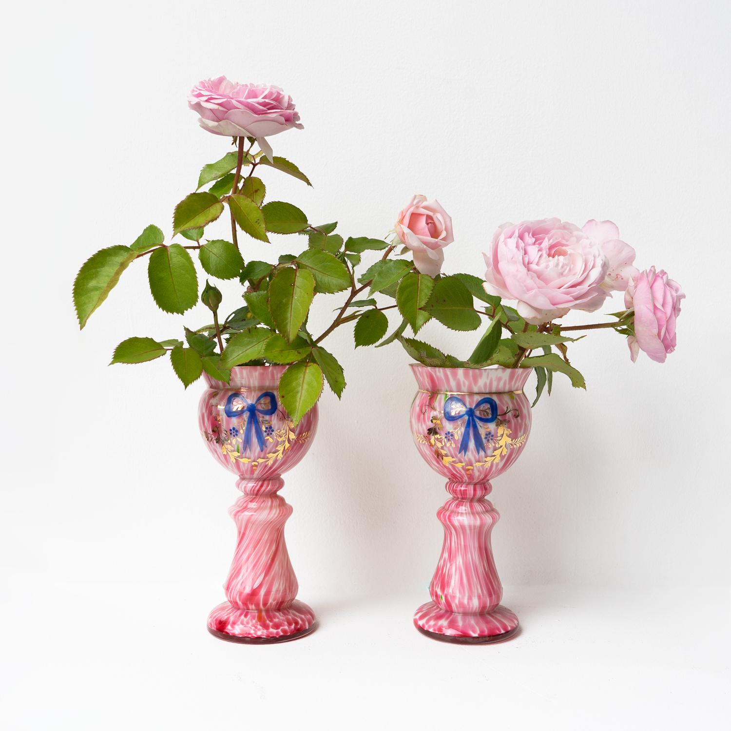 PAIR OF ANTIQUE GLASS VASES 

A highly decorative pair of vases of pleasing form.

Hand-blown glass with a pink and white marbled effect known as ‘splatter glass’. 

Gilt and enamelled decoration.

Bohemian, Czech in origin and probably an early