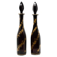 Pair of Antique Bohemian Ruby Red Cut Glass Decanters with Gilded Grapevine Vine