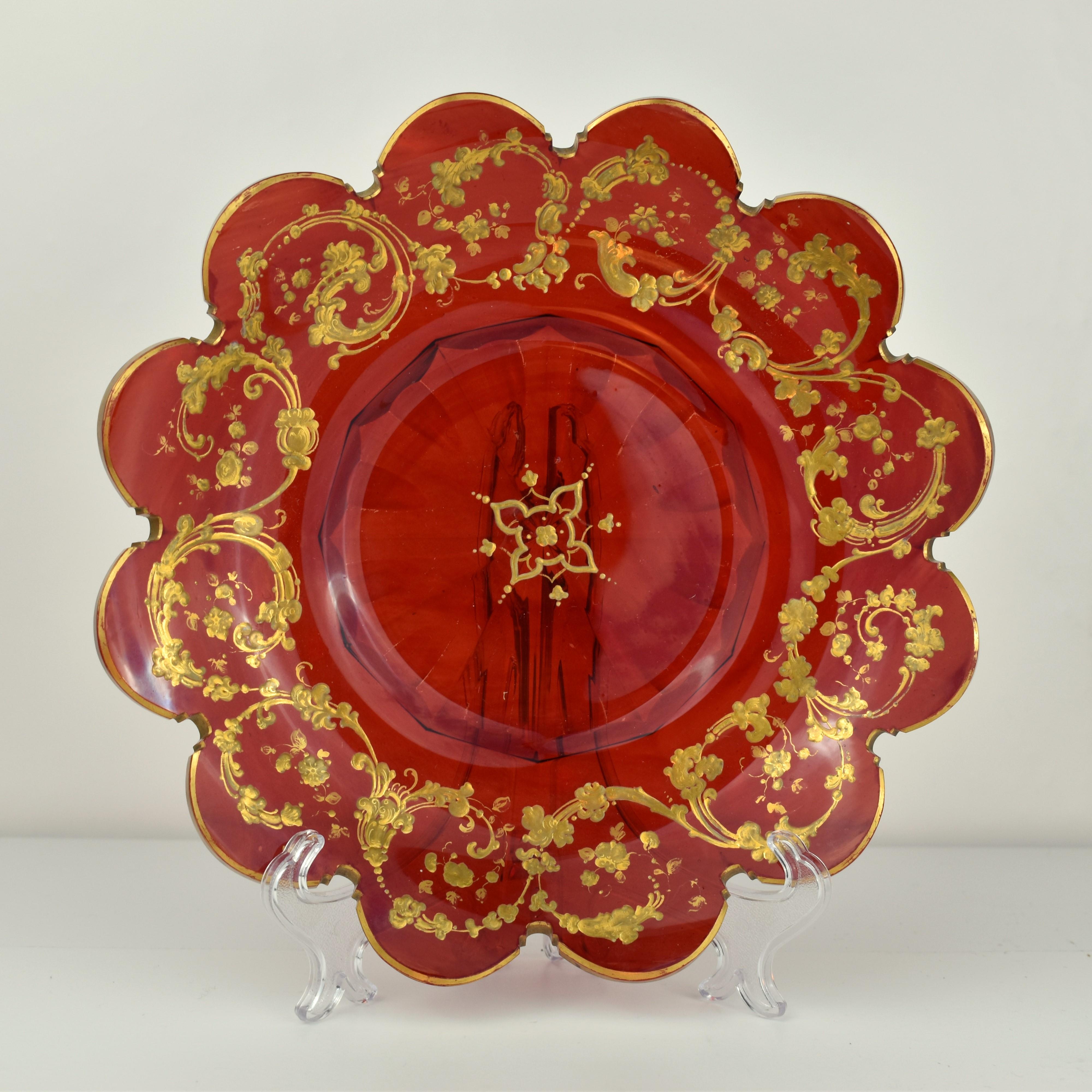 An elegant set of 2 large serving plates in ruby red crystal glass

Profuse gilded enamel decoration all around

Fine example of top quality Bohemien glass manufacture of the 19th century