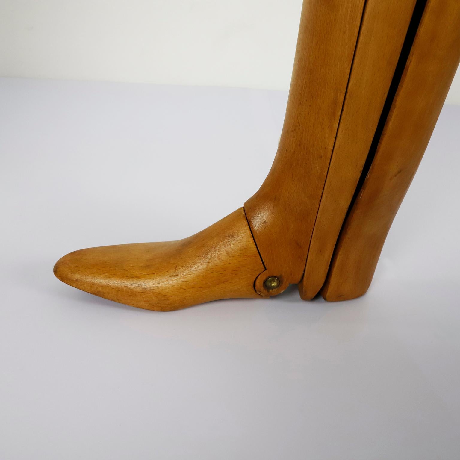 Circa 1960, we offer this pair of antique boots lasts.