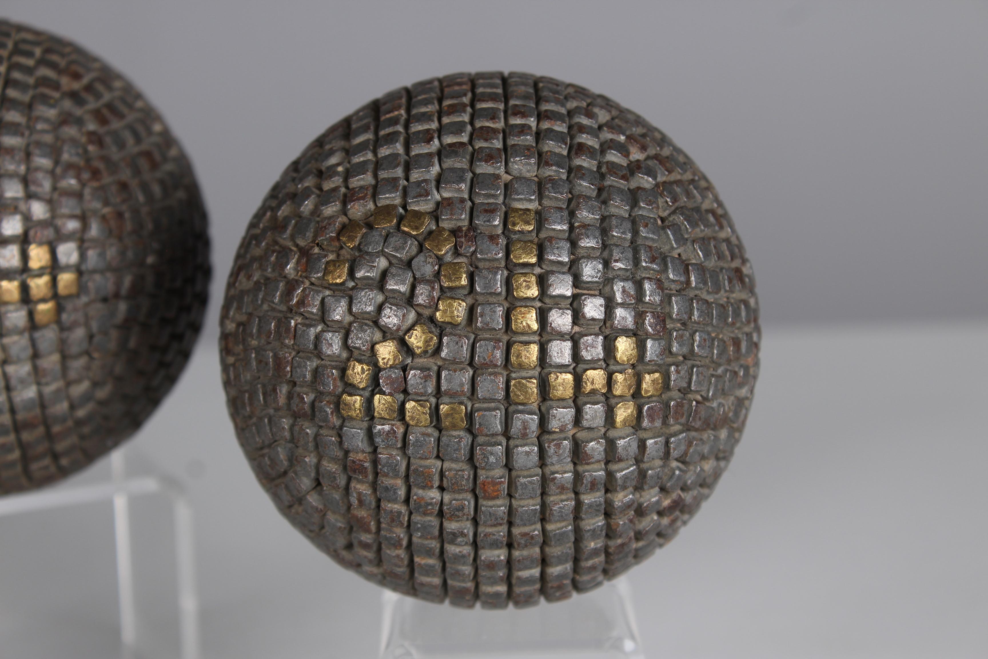 Beautiful, unique Boule ball pair and one target ball, France, late 19th Century.

In the 19th century, the manufacture of boules balls underwent significant development in France as the game of boules, particularly the pétanque variant, gained in