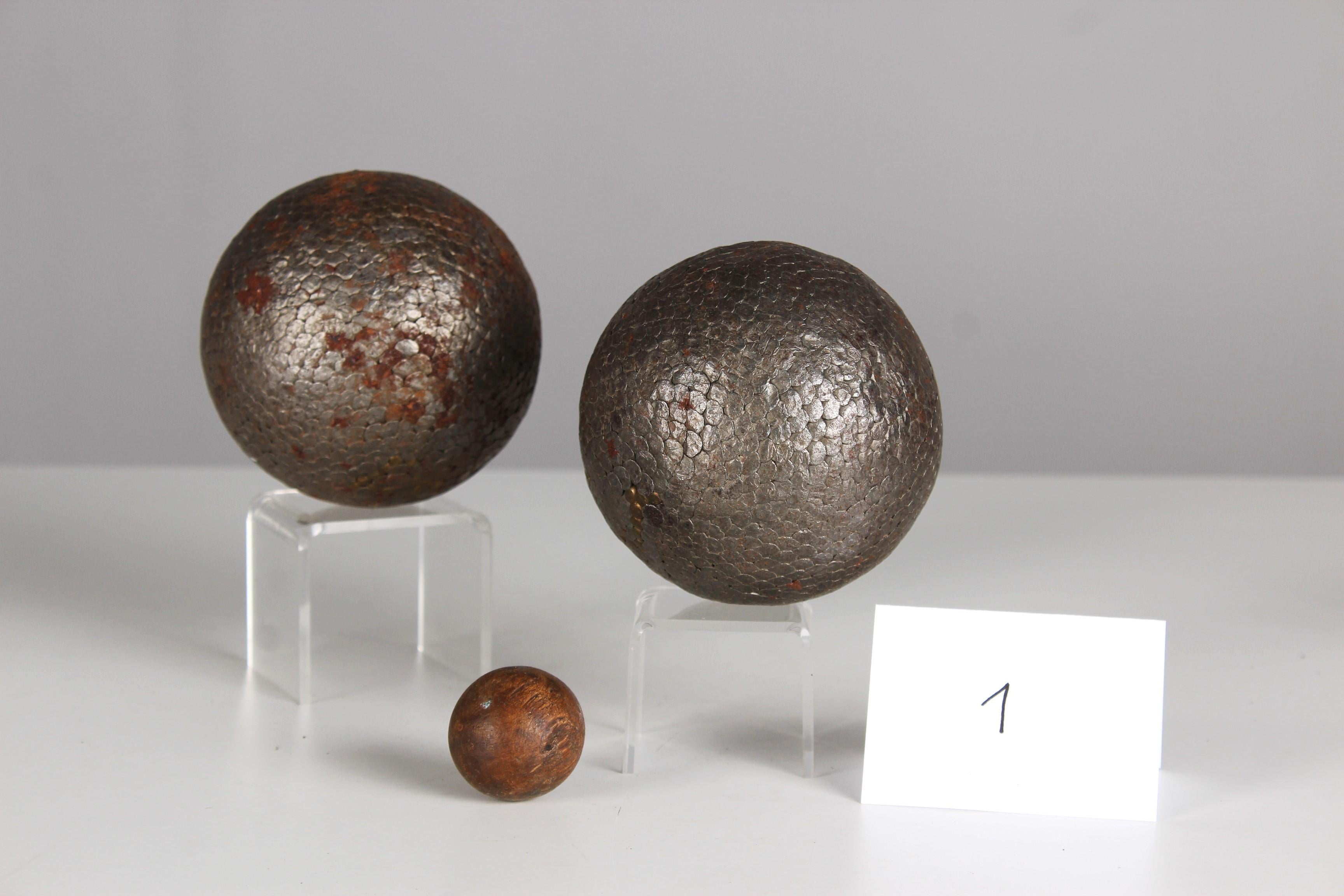 Beautiful, unique Boule ball pair and one target ball, France, late 19th Century.

In the 19th century, the manufacture of boules balls underwent significant development in France as the game of boules, particularly the pétanque variant, gained in