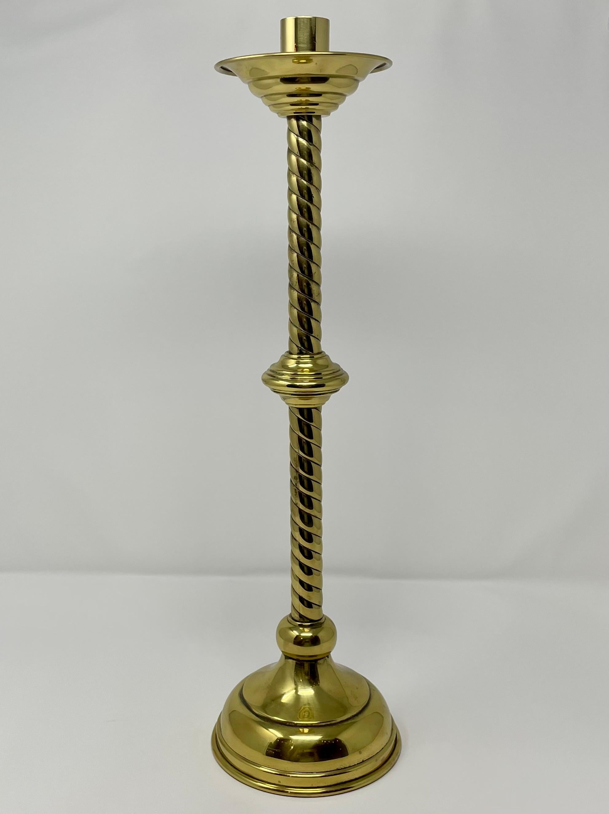 Pair of antique brass candlesticks.