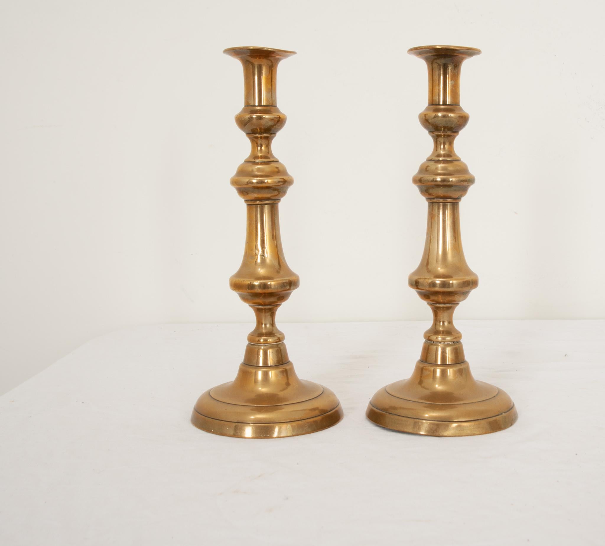 Cast Pair of Antique Brass Candlesticks For Sale