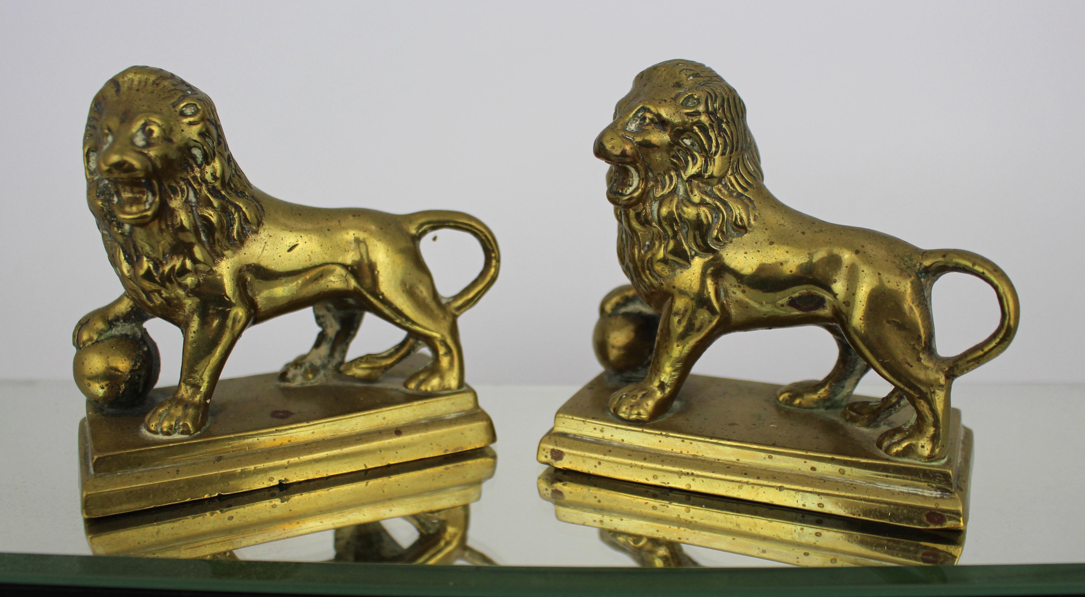 Antique Brass Lion Paperweights – Matched Pair

A fine pair of antique brass lion figurines, each featuring a lion resting its paw on a spherical object. These pieces, with a good weight, are ideal as paperweights and display a subtle elegance. The