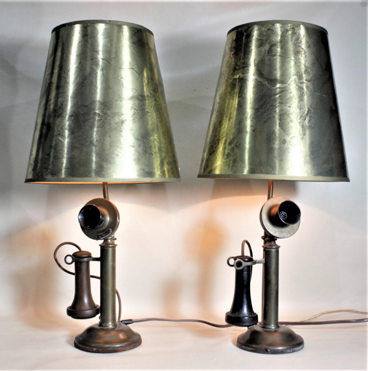 This very unique pair of table lamps began as a pair of brass and Bakelite candlestick telephones made by the Northern Electric Company of Canada in circa 1920. These authentic telephones have been wired and fitted with switches on their bases and