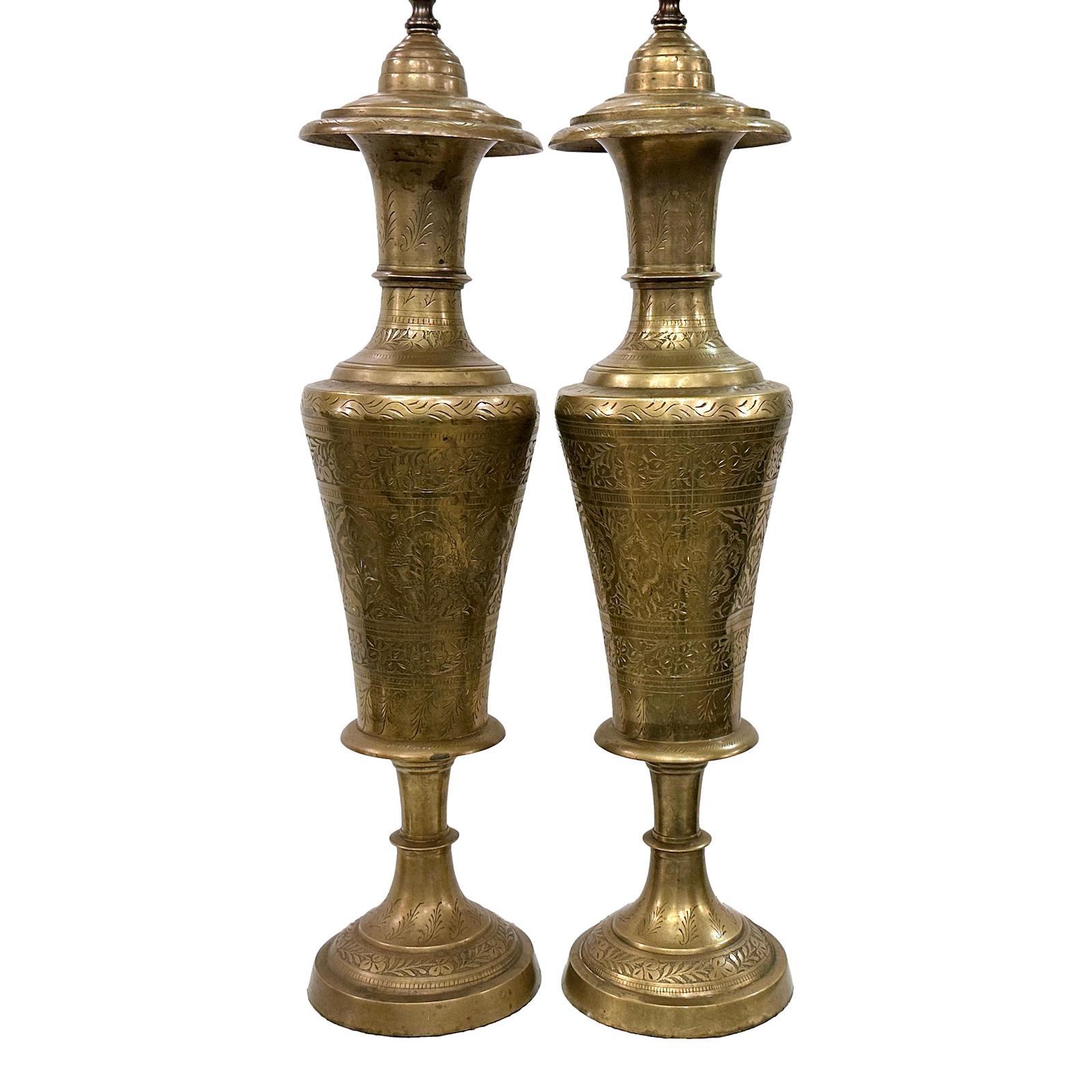 Pair of Turkish circa 1920's etched brass lamps with foliage motif. One has a dent on the side of the body.

Measurements:
Height of body: 25