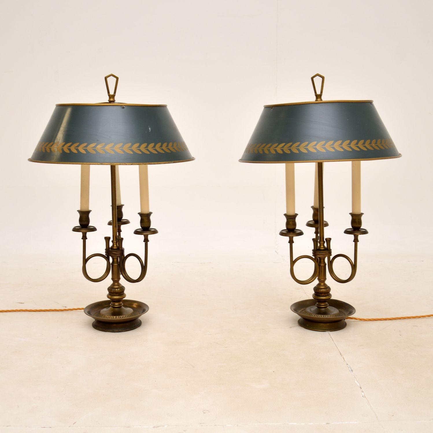 A superb pair of antique table lamps in solid brass, with fantastic tole shades. They were made in England, and date from around the 1930’s.

The quality is outstanding, they have a gorgeous design and the brass has acquired a gorgeous, deep