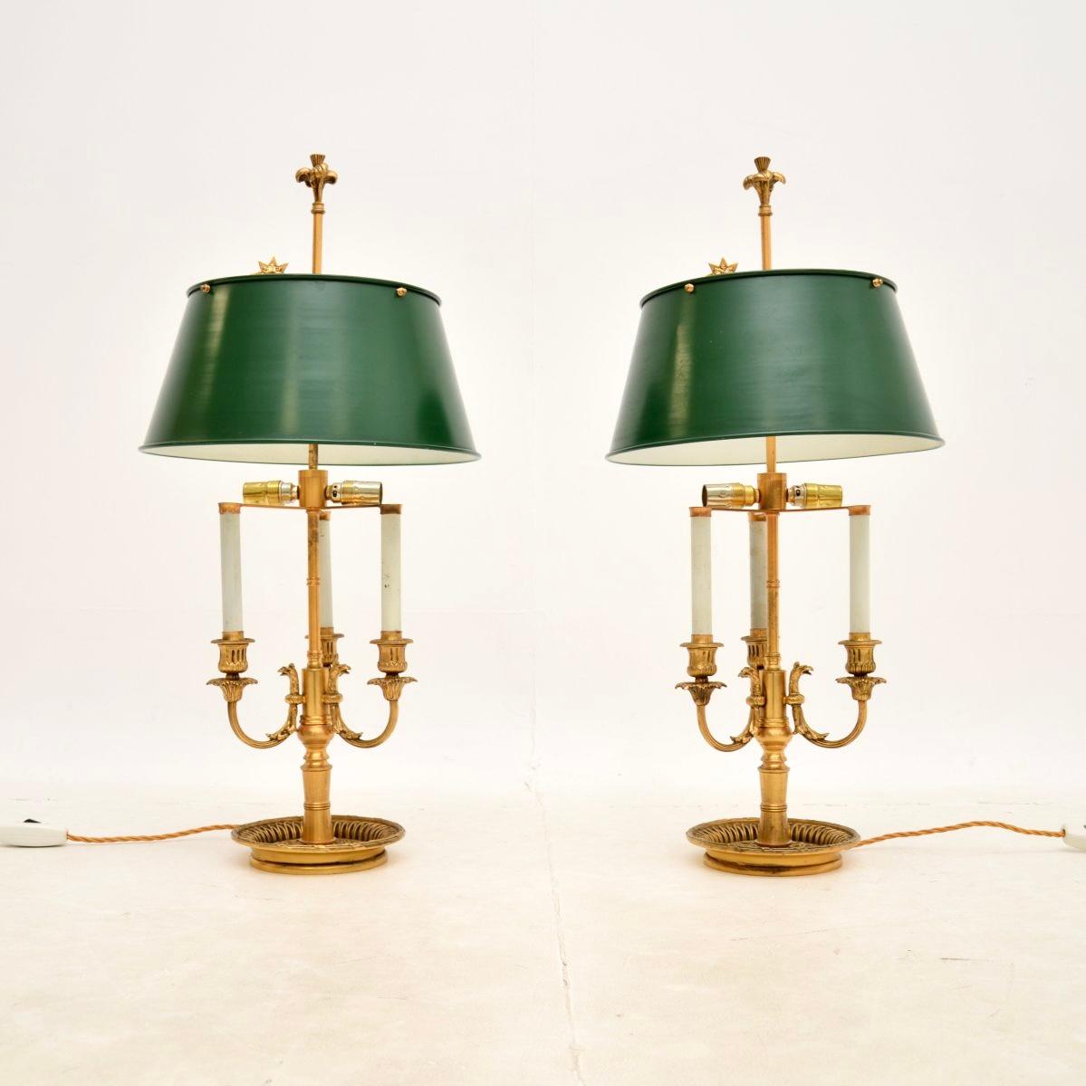 An outstanding large pair of antique brass table lamps with tole shades. We believe they were made in France, and date from around the 1920-30’s.

The quality is superb, the solid brass frames are beautifully made and are very heavy. They have