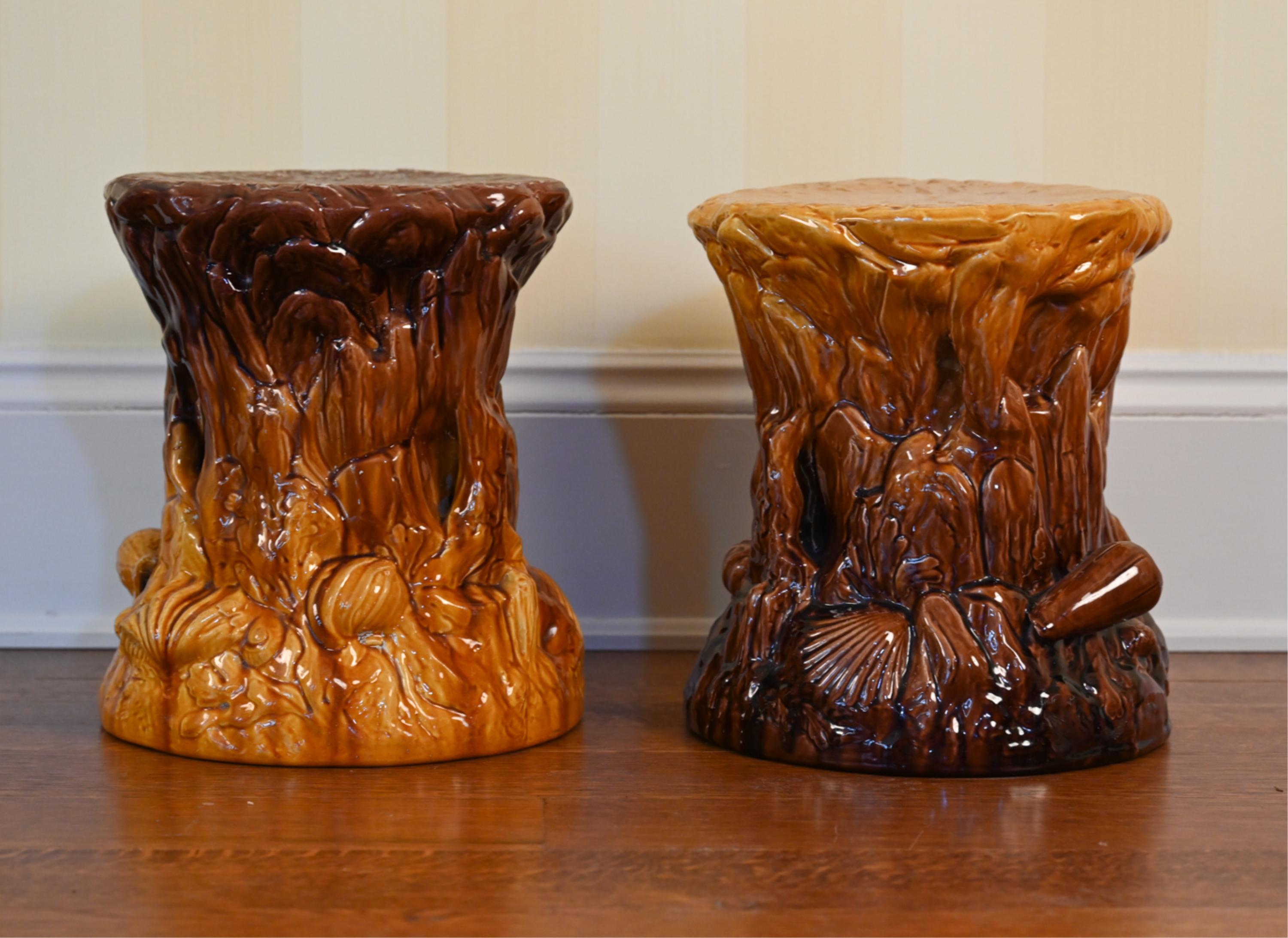Coordinated pair of antique ceramic garden stools or jardiniere stands in caramel and brown glaze, with coral and aquatic life motifs in high relief. One slightly taller than the other, both with impressed Bretby England marks inside.