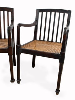 Pair of Antique British Colonial Teak and Rattan Hall Elbow Chairs, circa 1900