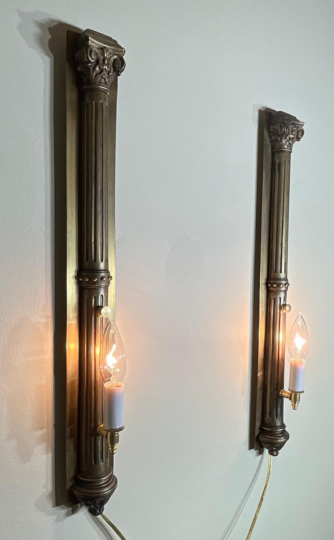 Cast Pair of Antique Bronze and Brass Sconces - Elegant Wall Lights For Sale