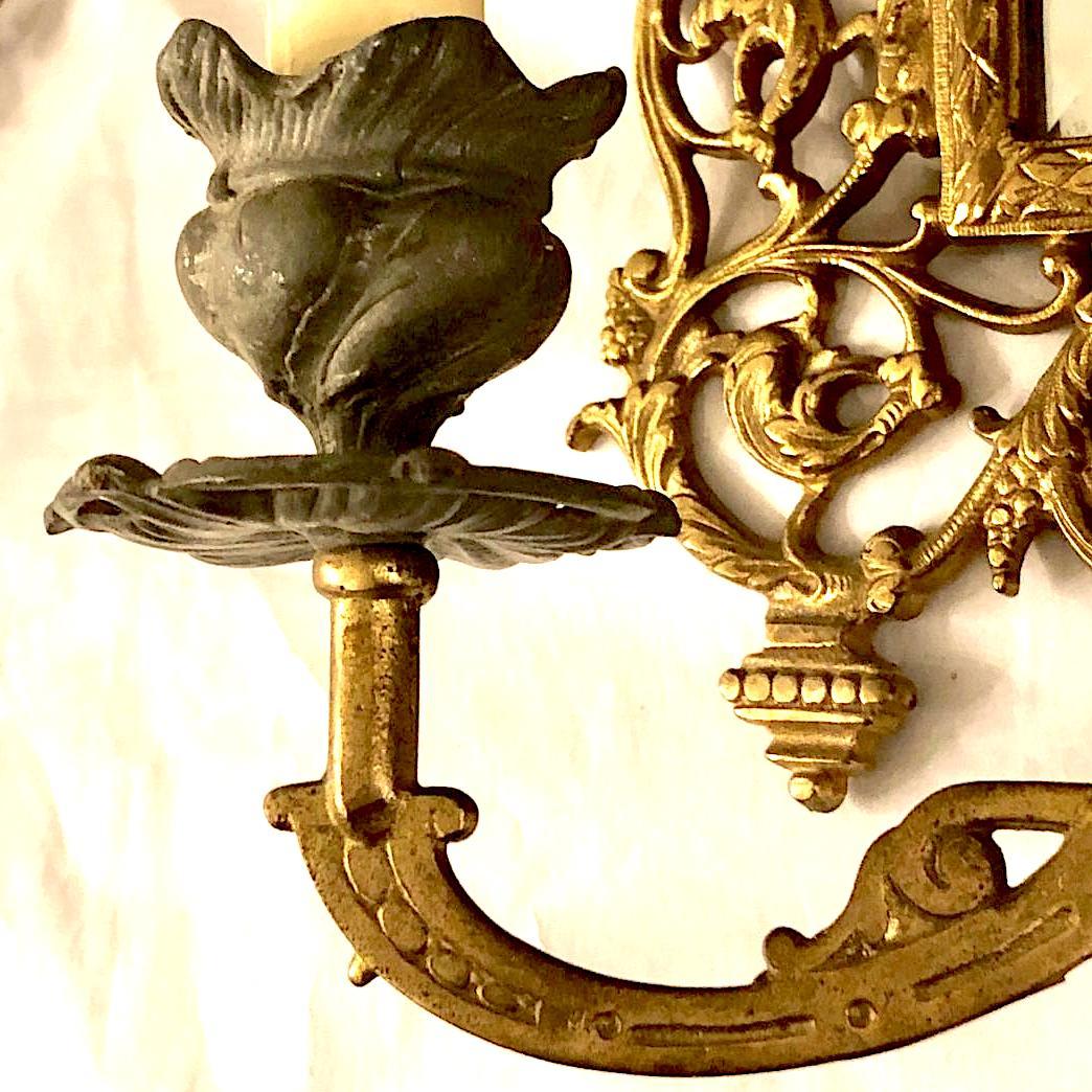 Gilt Pair of Antique Bronze Mirrored Sconces For Sale