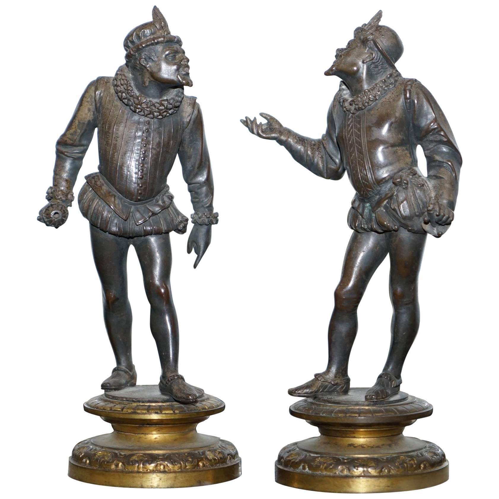 Pair of Antique Bronze Statues of Chaps Getting Ready to Duel Gloves Thrown Down