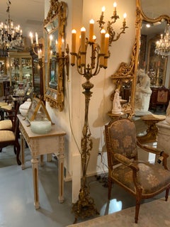 Pair of antique bronze torchiers/ floor lamps