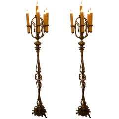 Pair of antique bronze torchiers/ floor lamps