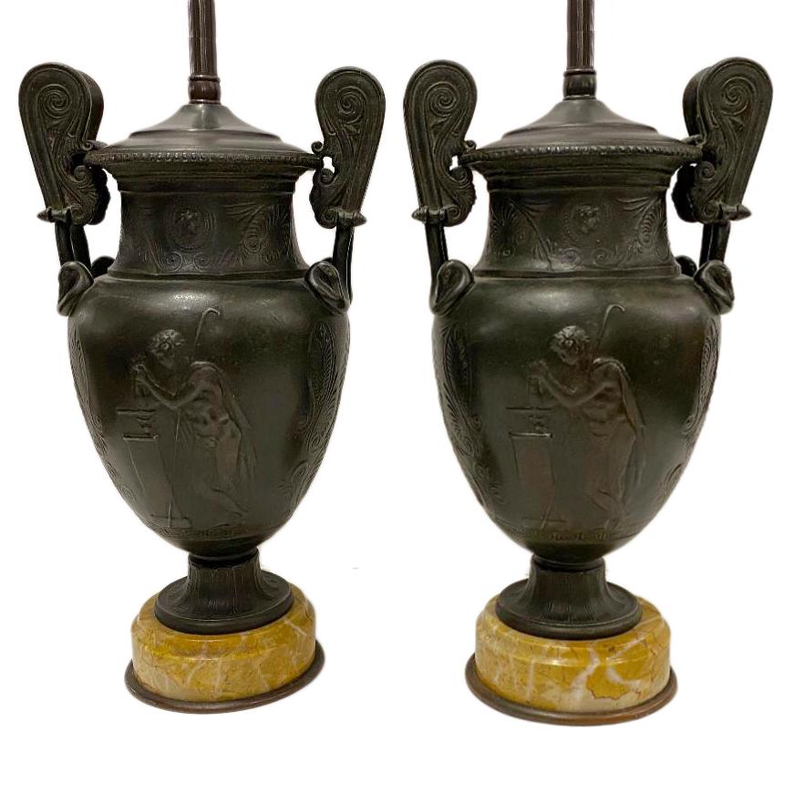 Pair of 19th century French bronze urns on marble bases, mounted as lamps.

Measurements:
Height of body 12