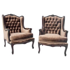 Pair of antique bronze wingback armchairs, France, circa 1920.